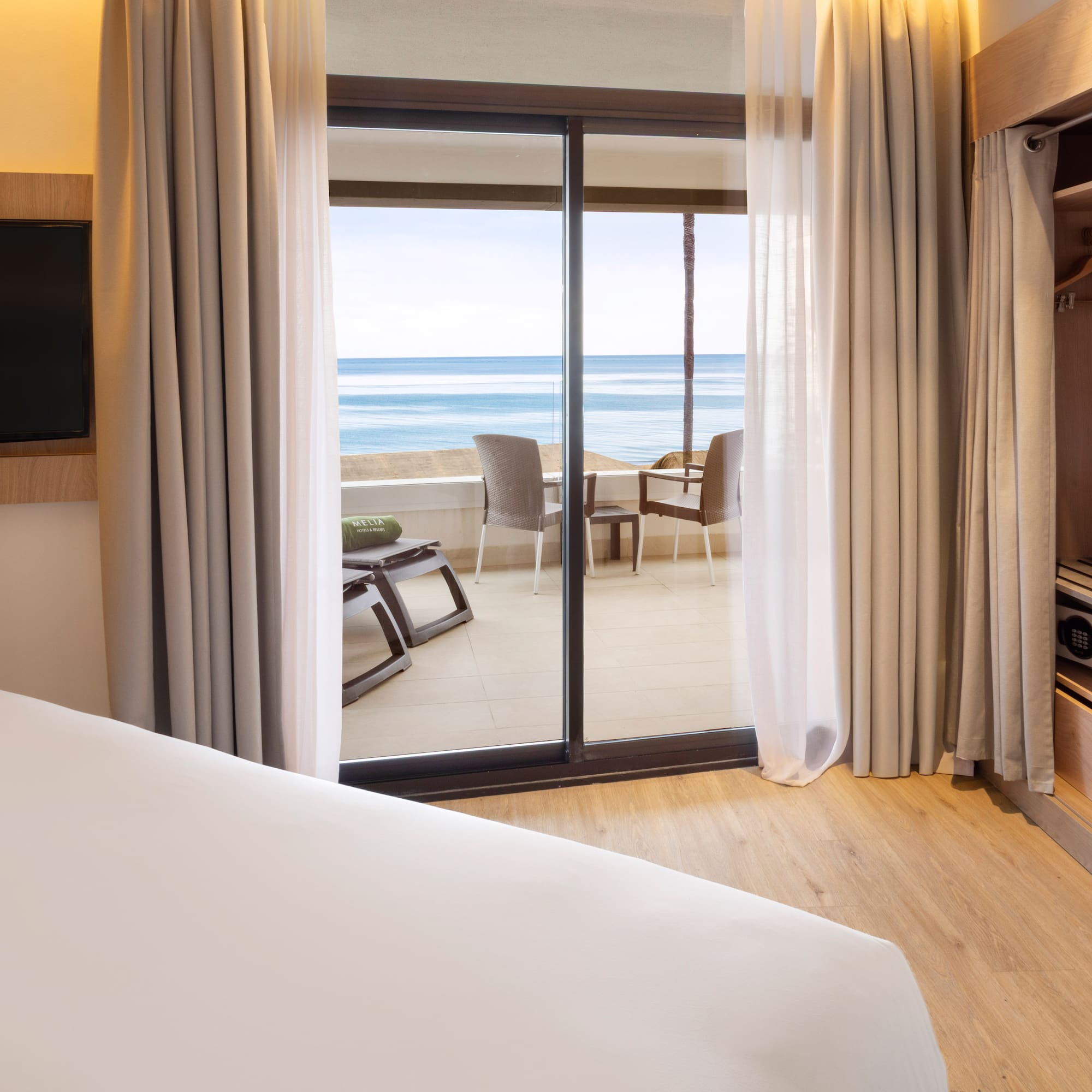 a room with a television and a bed