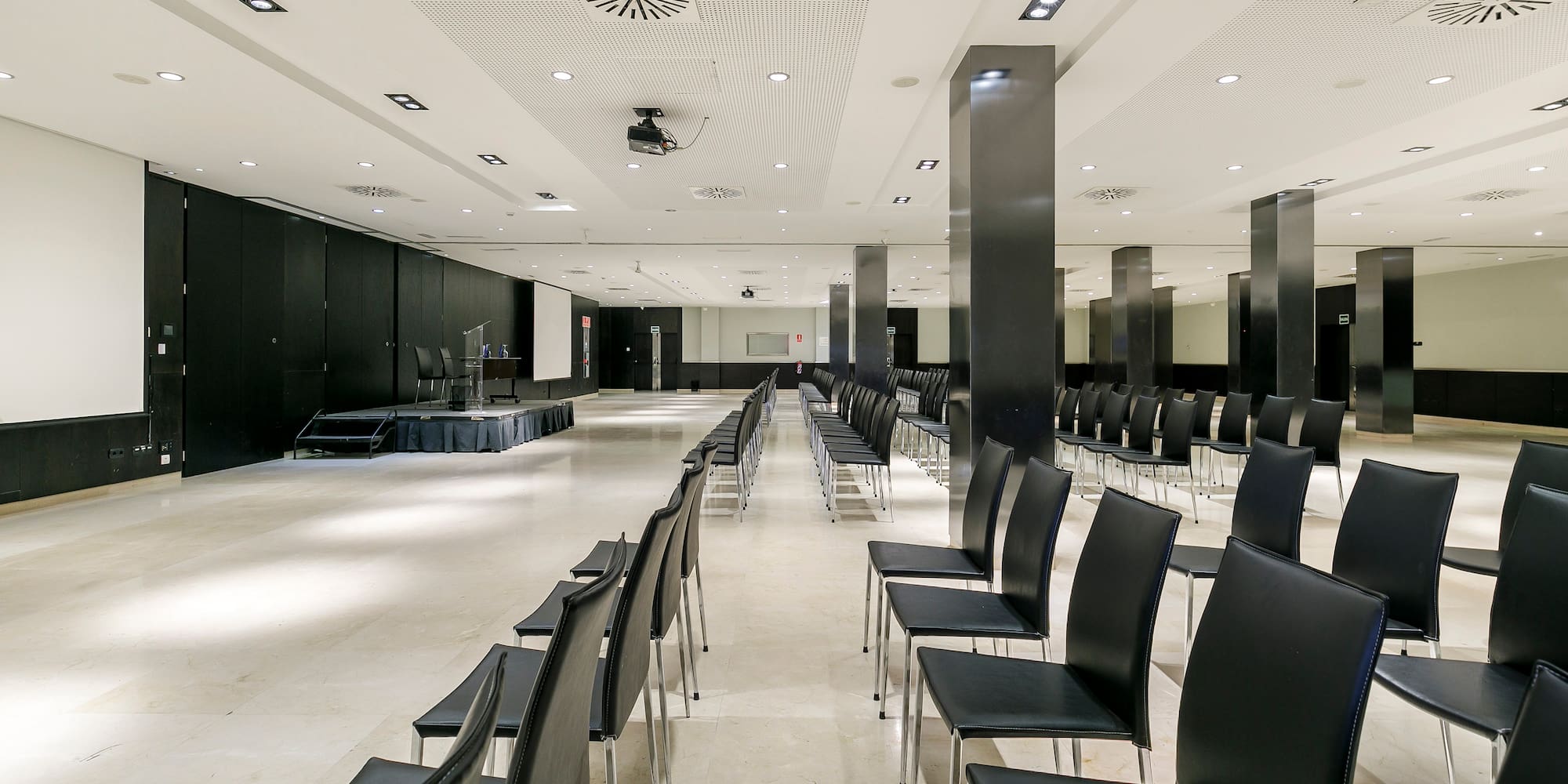 a room with black chairs