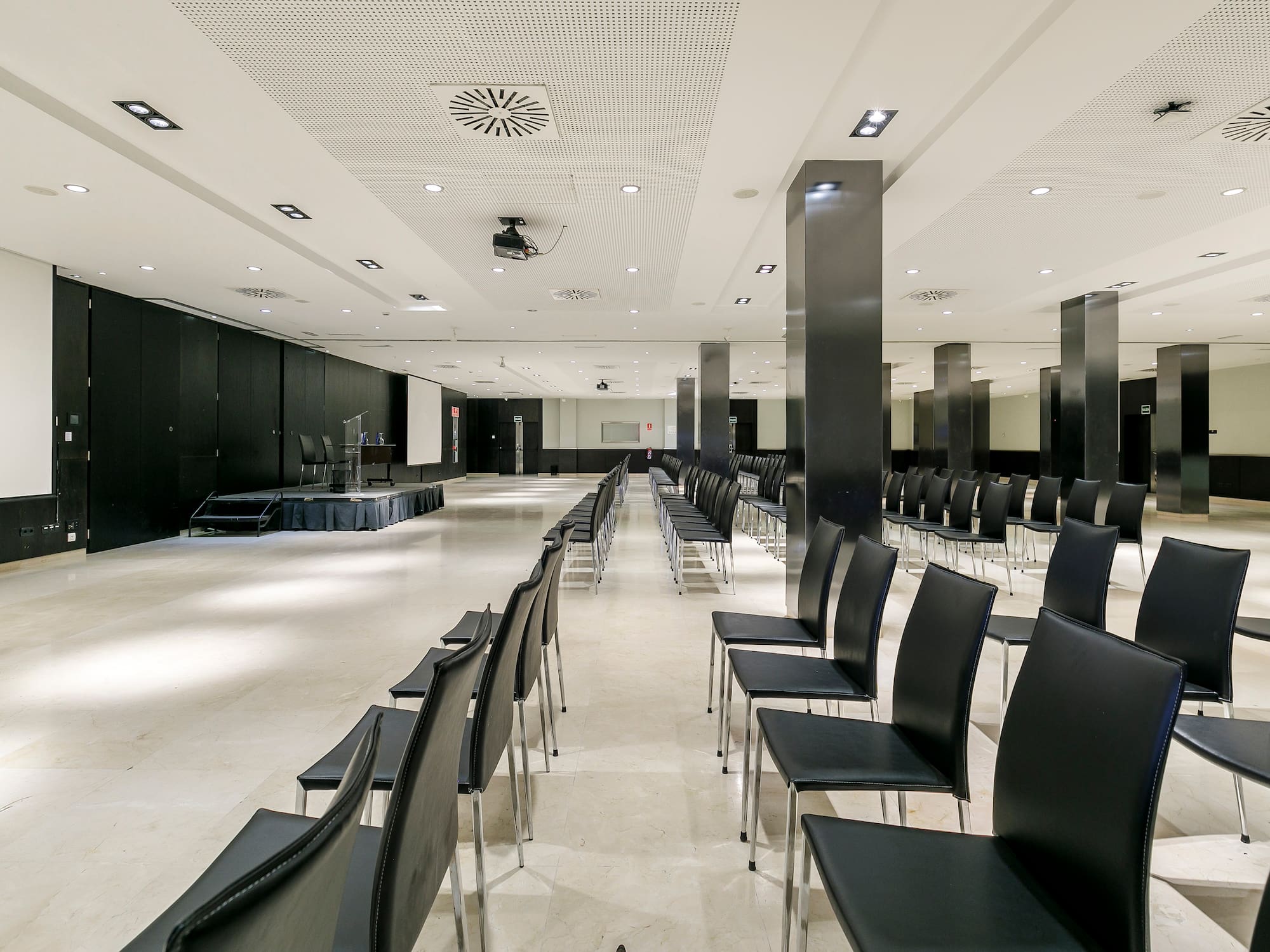 a room with black chairs