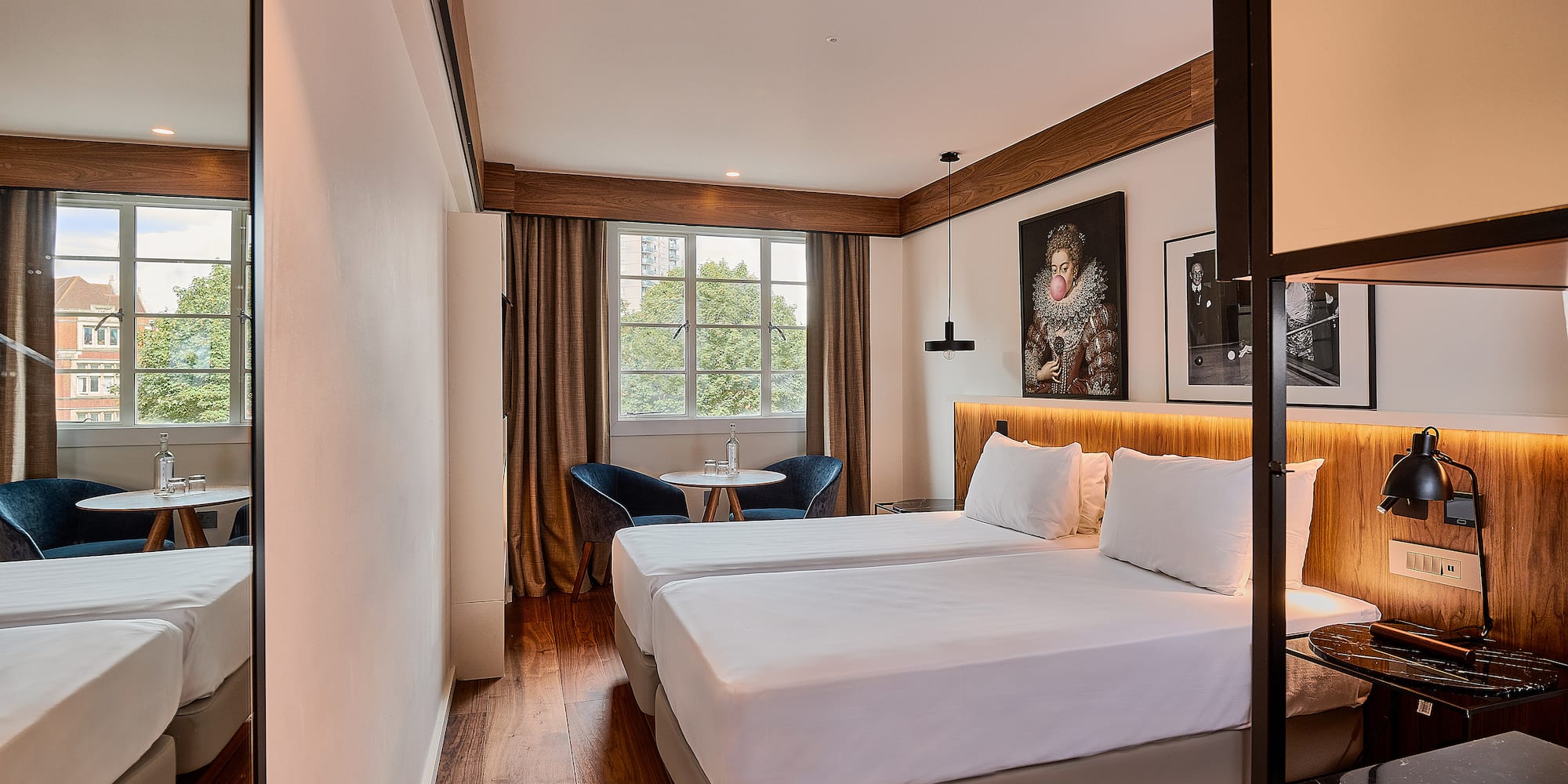 a room with two beds and a table