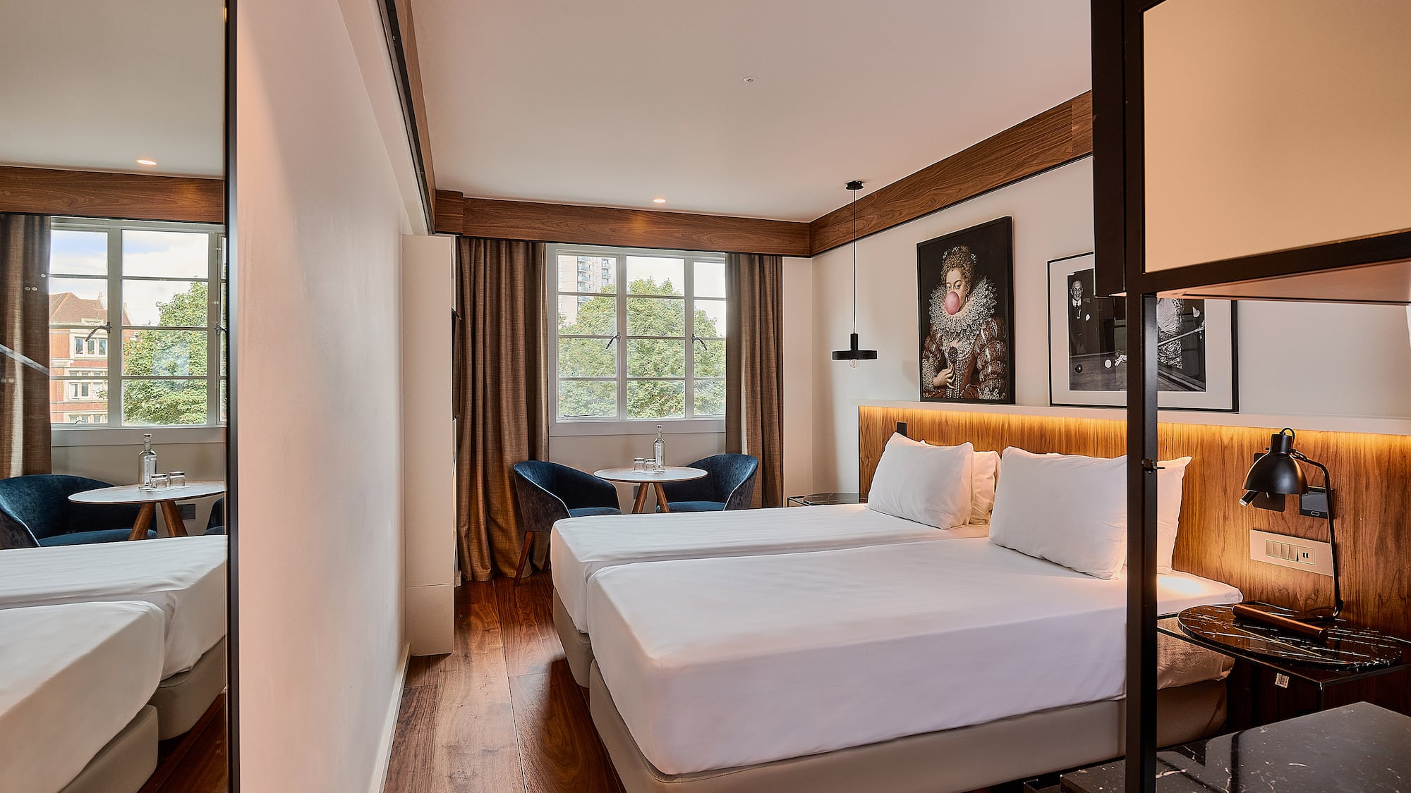 a room with two beds and a table