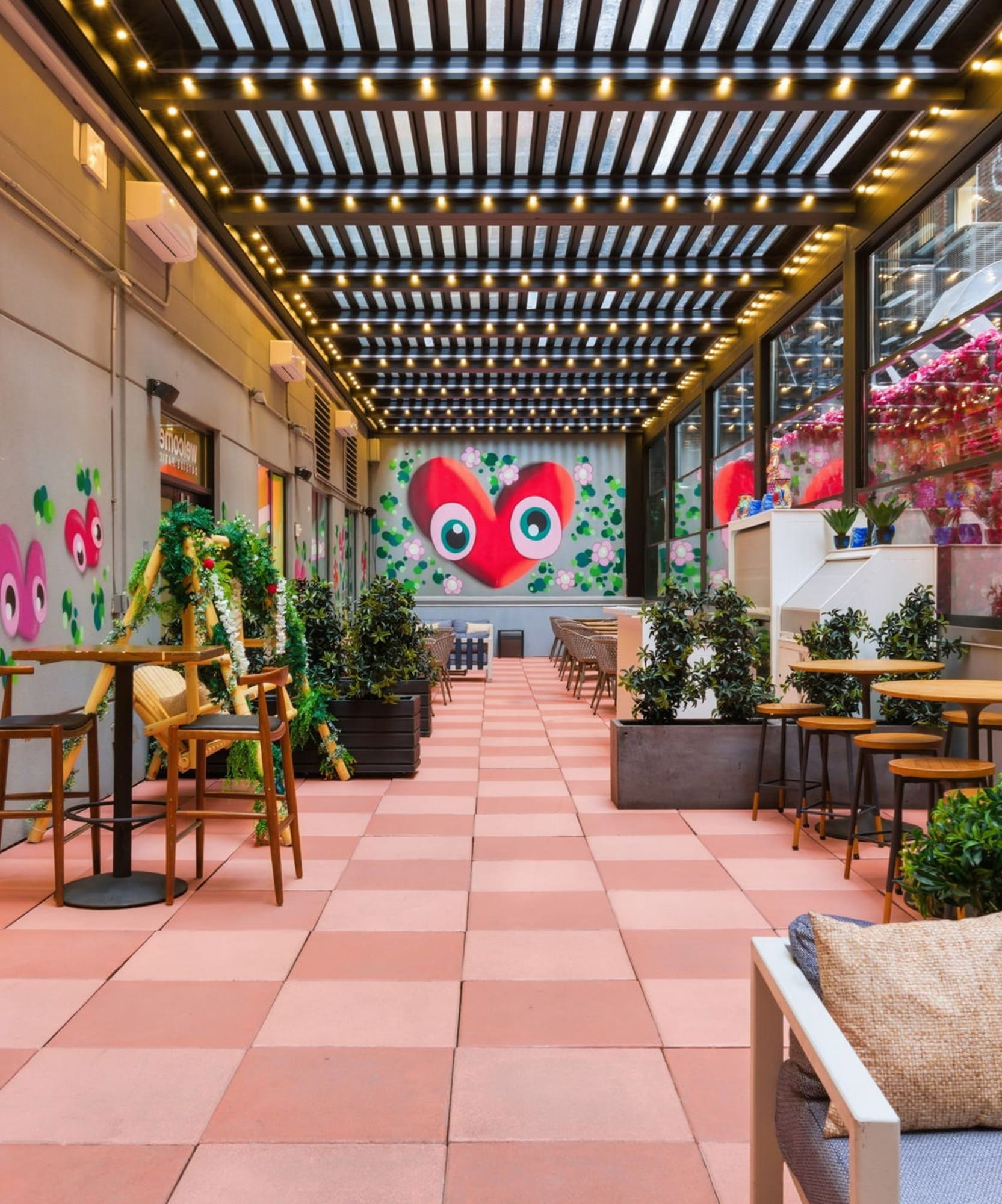 a patio with tables and chairs