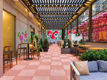 a patio with tables and chairs