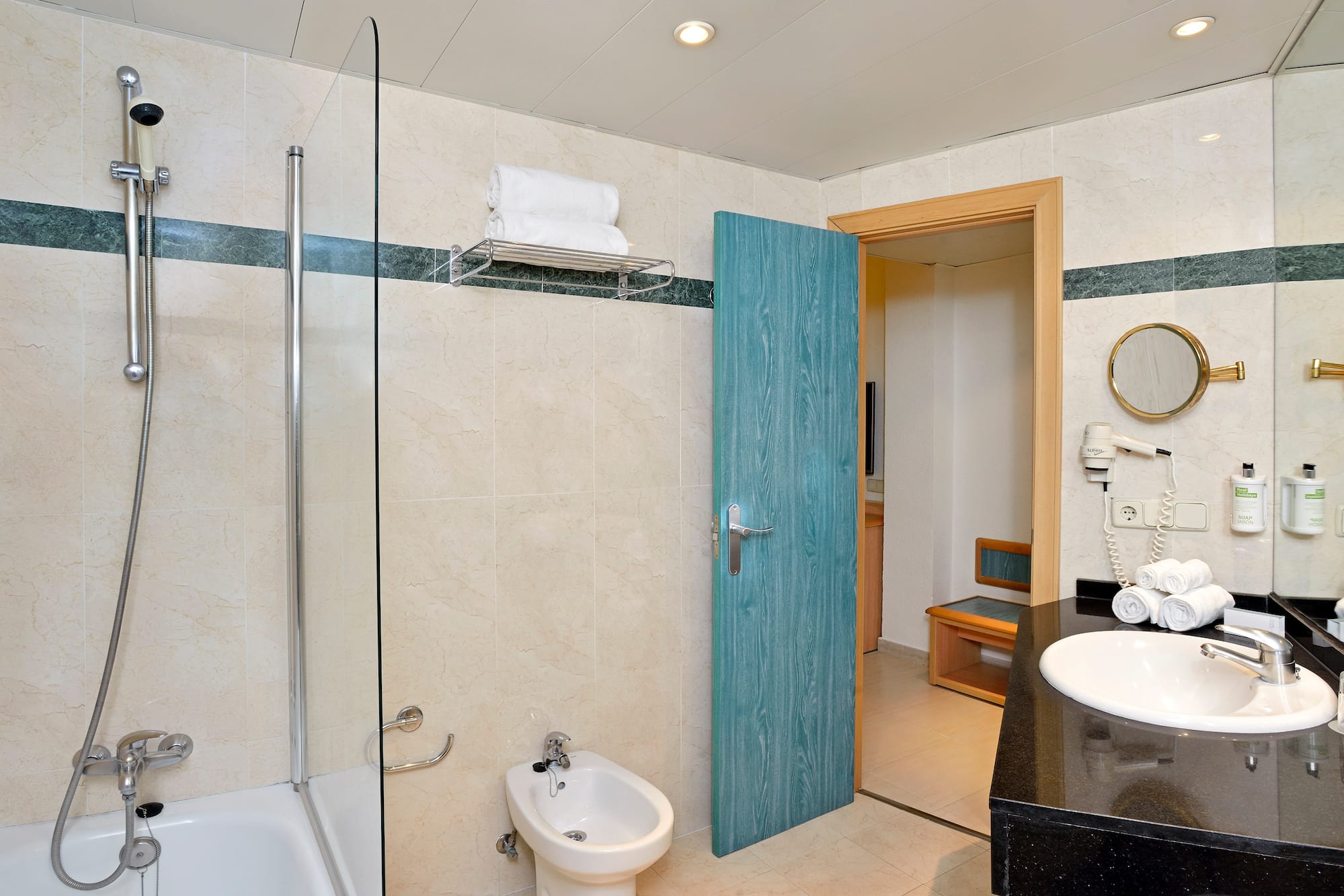 a bathroom with a blue door and a shower