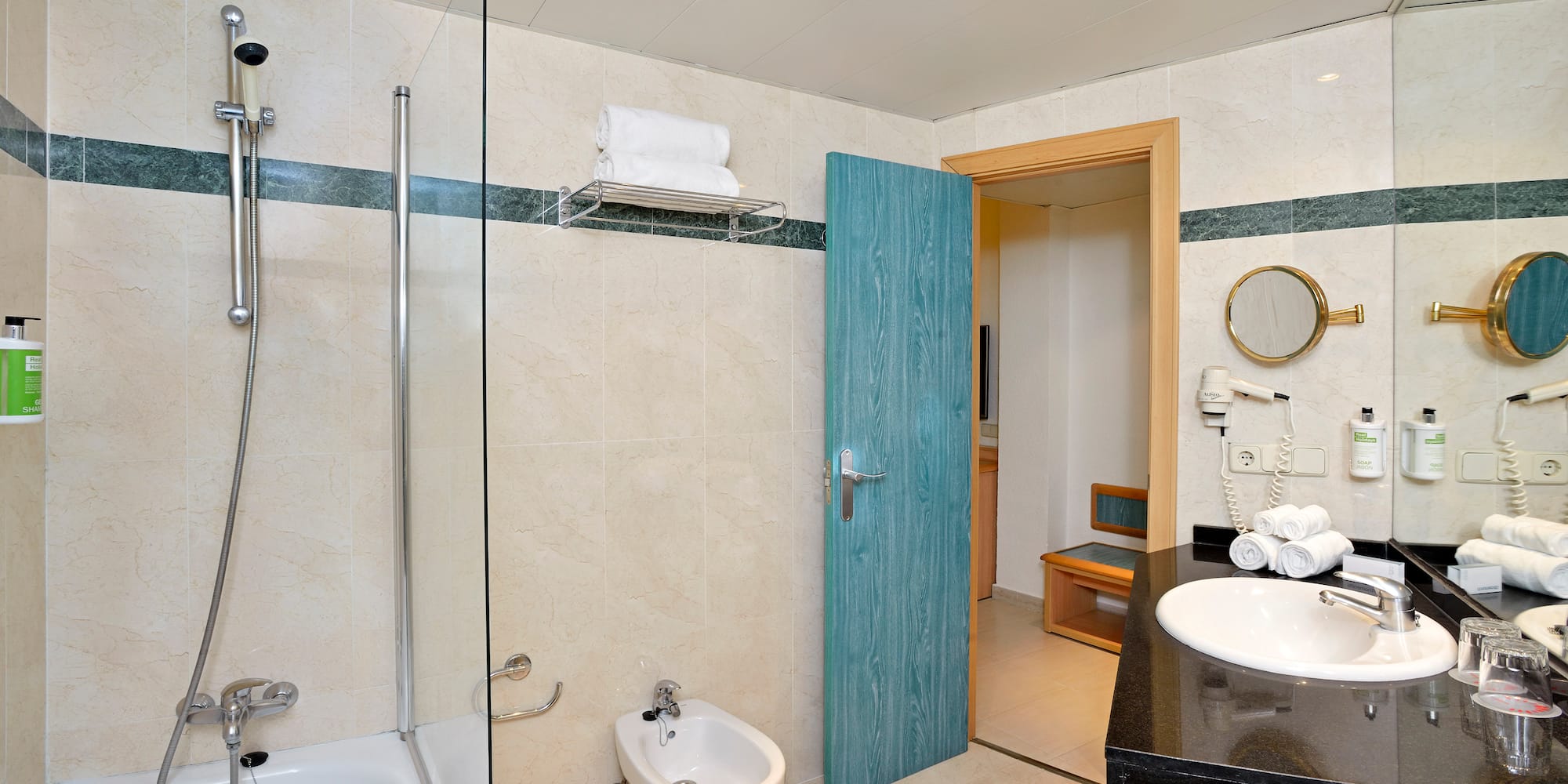 a bathroom with a blue door and a shower