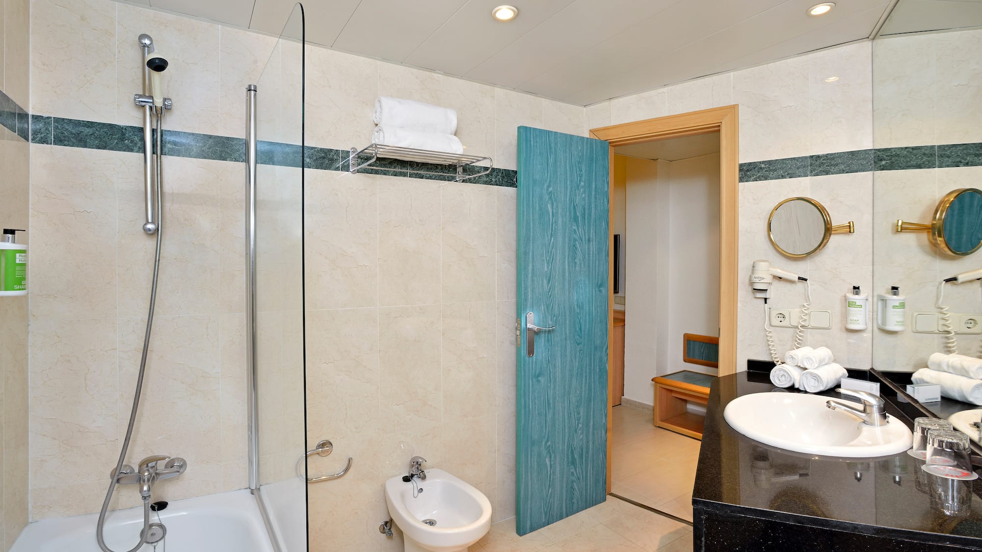 a bathroom with a blue door and a shower