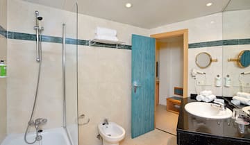 a bathroom with a blue door and a shower