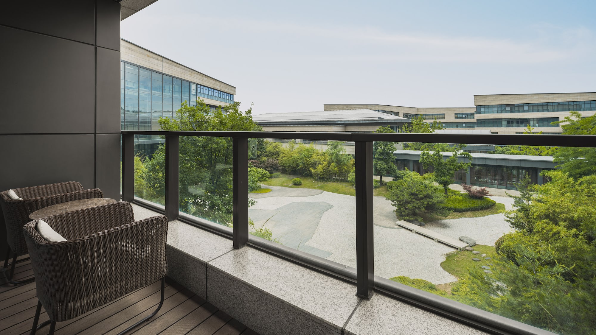 a balcony with a view of a city and trees