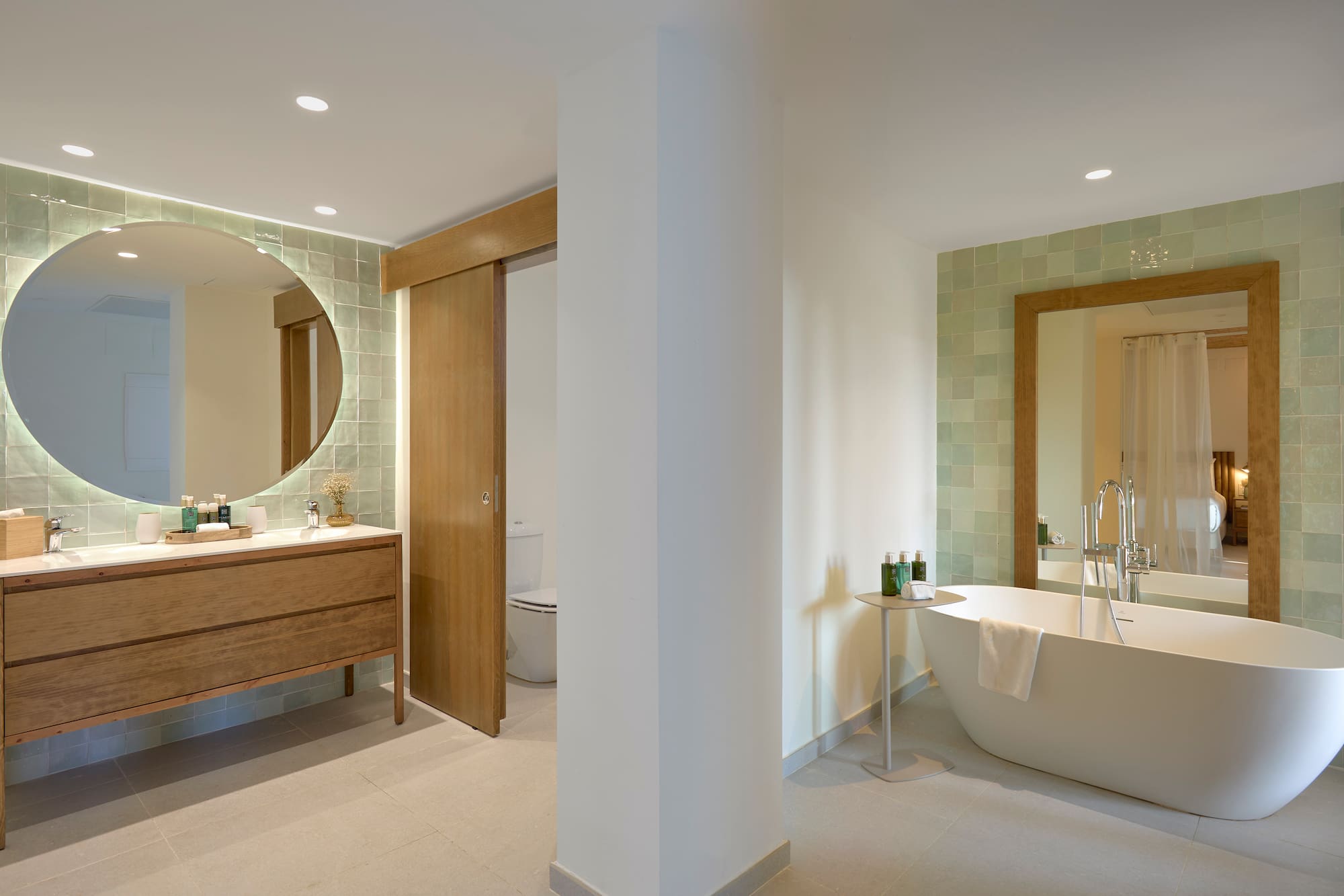 a bathroom with a tub and a mirror