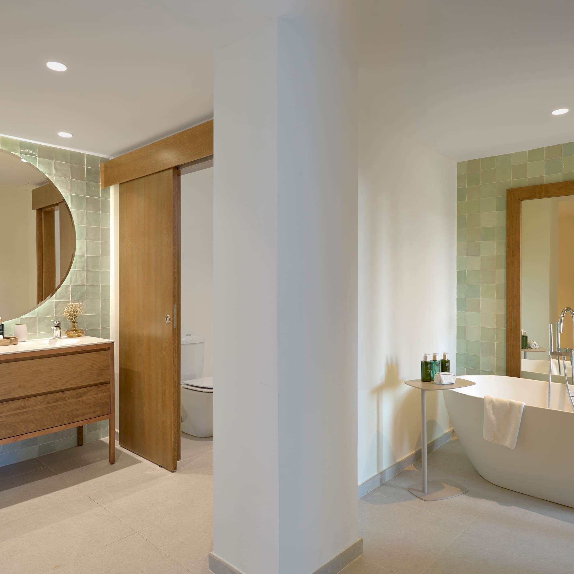 a bathroom with a tub and a mirror