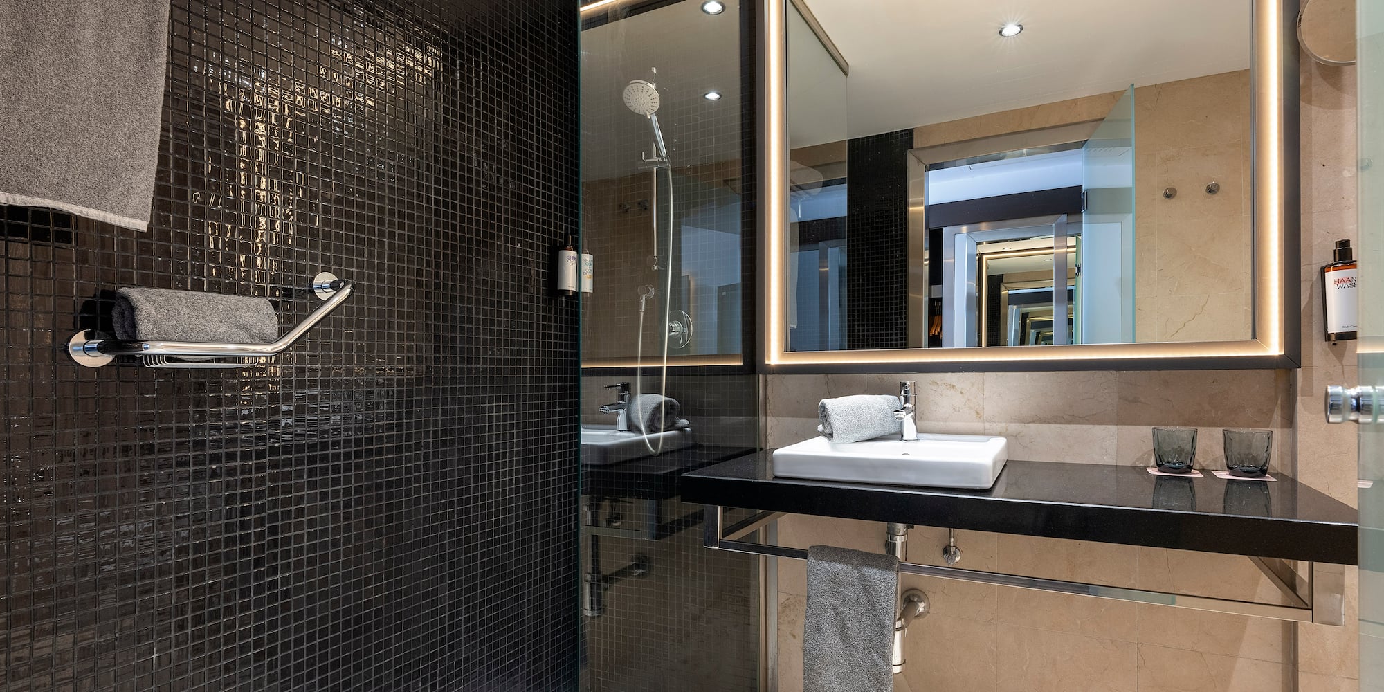 a bathroom with a shower and sink