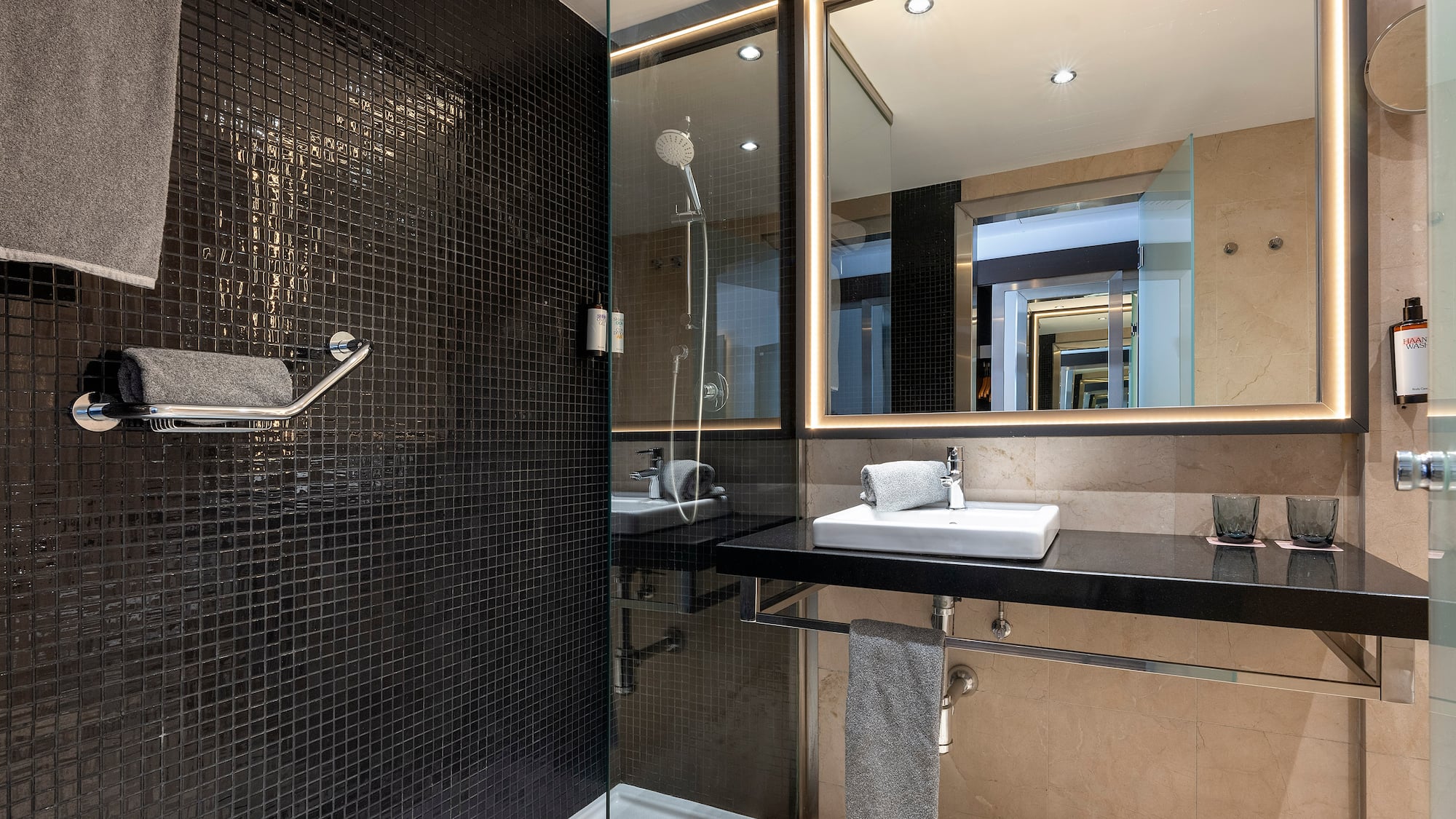 a bathroom with a shower and sink