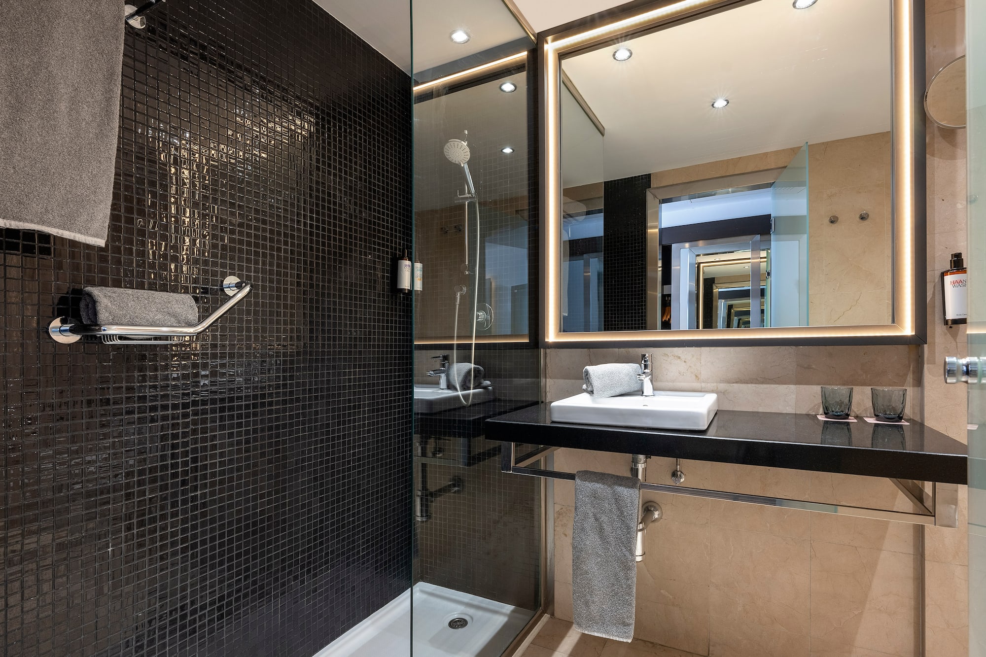 a bathroom with a shower and sink