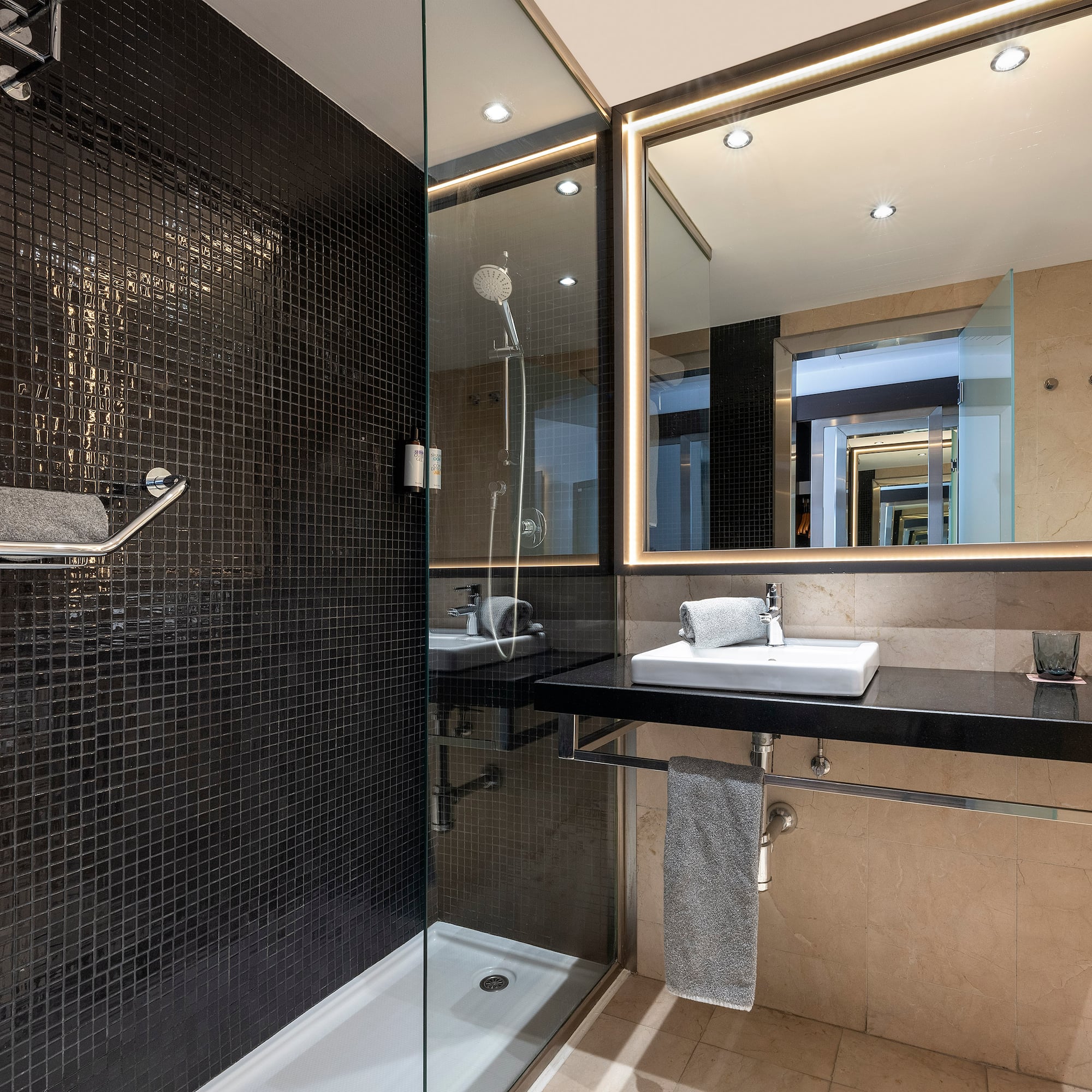 a bathroom with a shower and sink