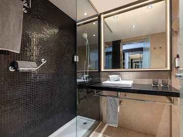 a bathroom with a shower and sink
