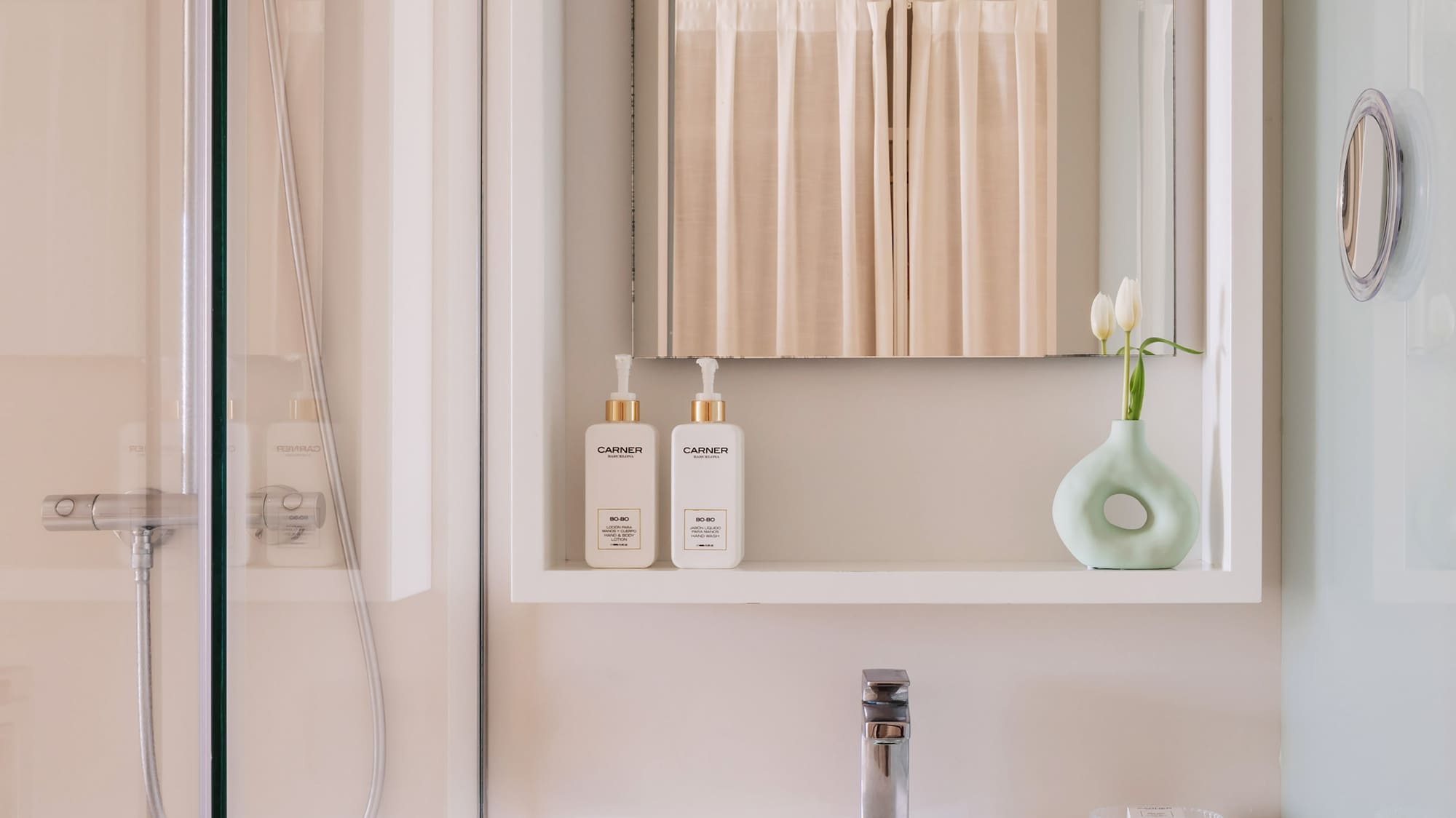a bathroom with a mirror and a sink