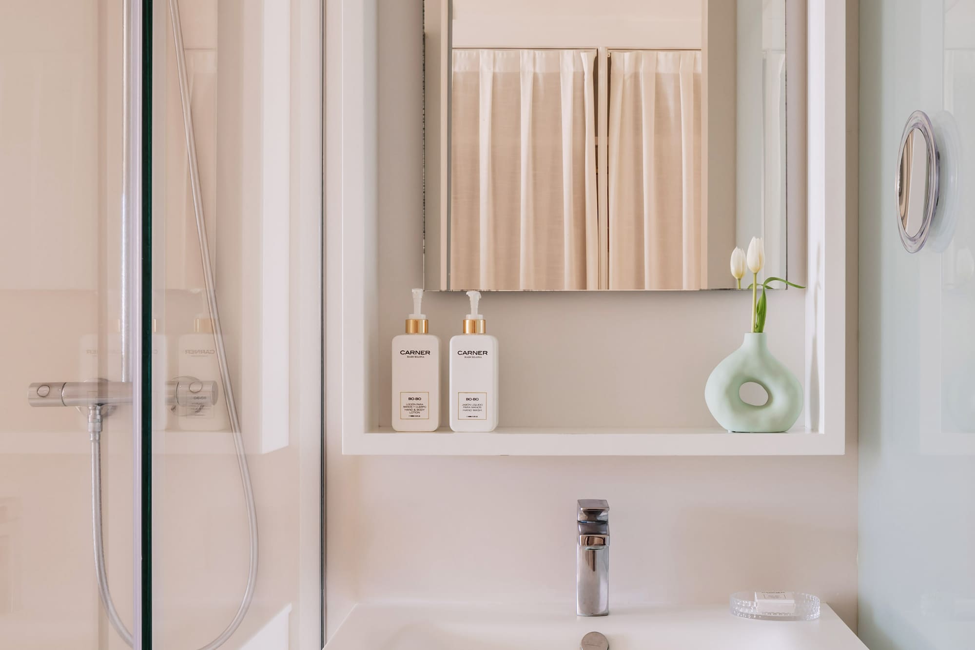 a bathroom with a mirror and a sink