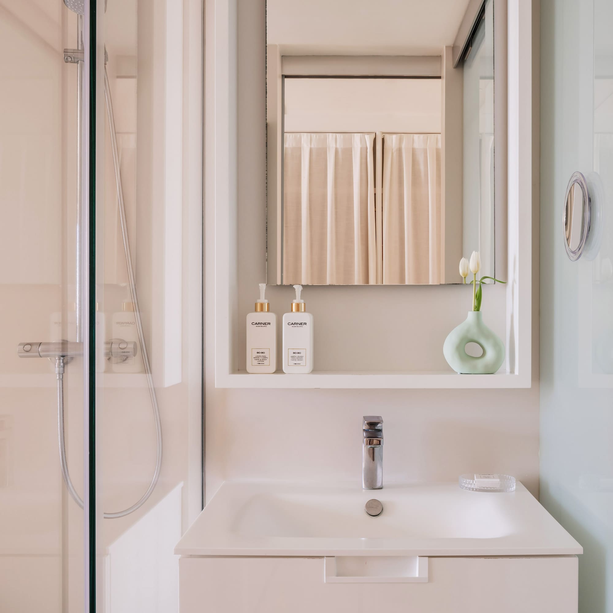 a bathroom with a mirror and a sink