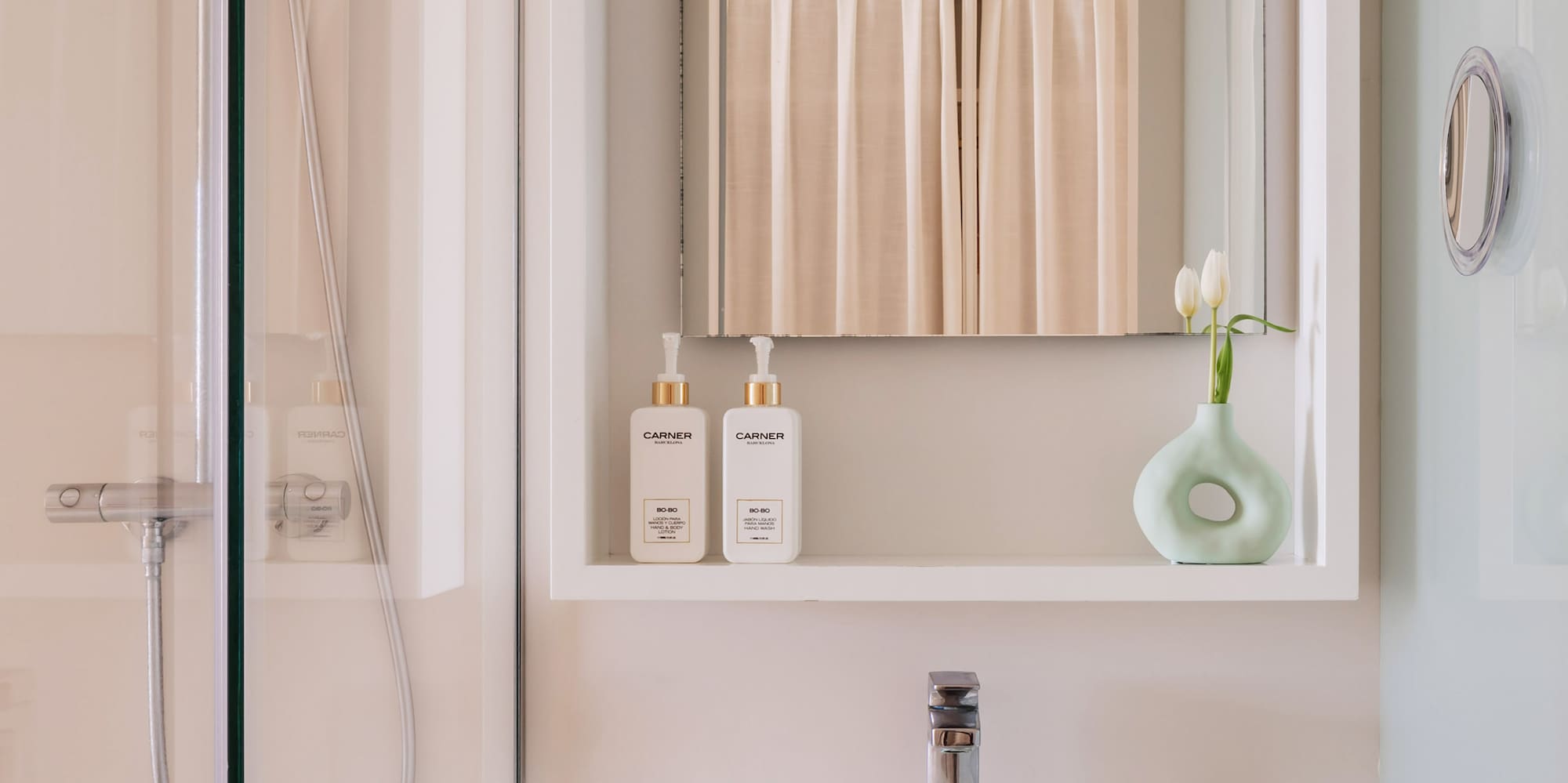 a bathroom with a mirror and a sink