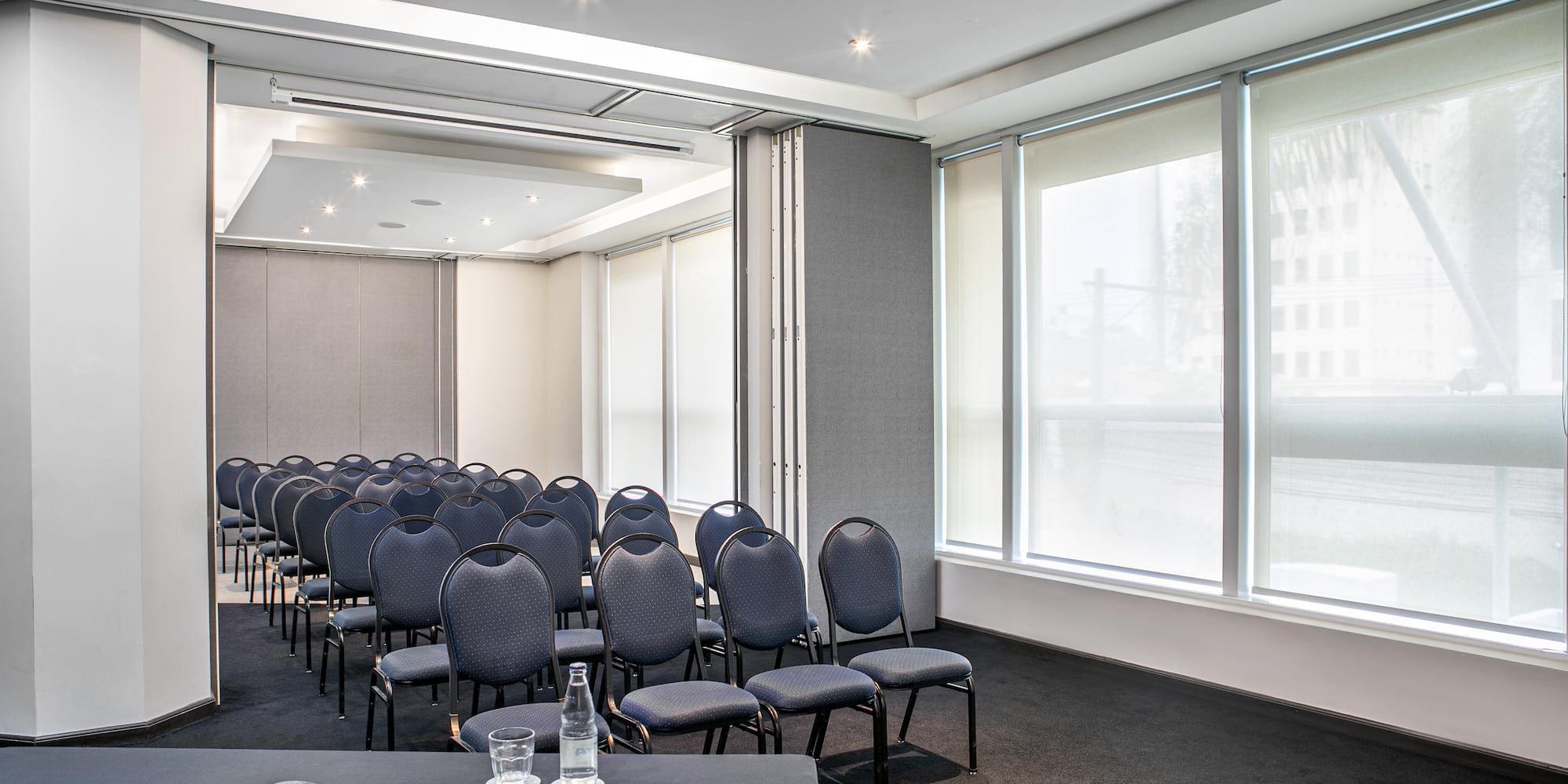 a room with many chairs and a table