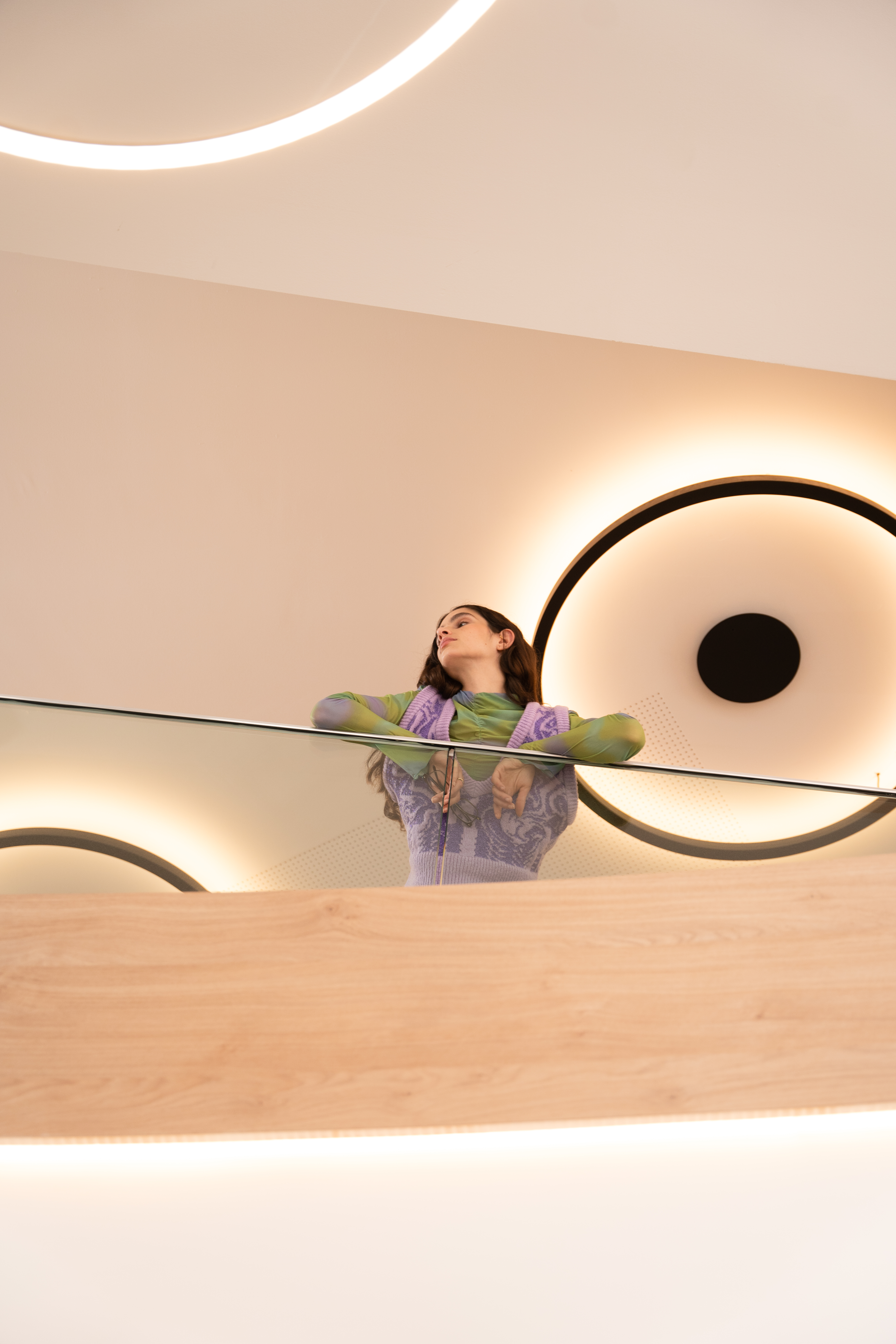 a woman leaning on a railing