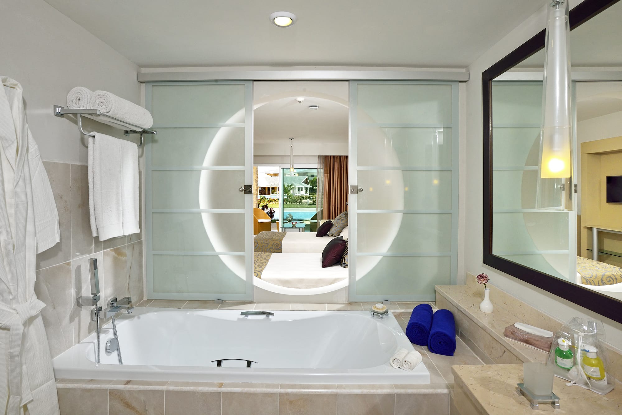 a bathroom with a tub and a mirror