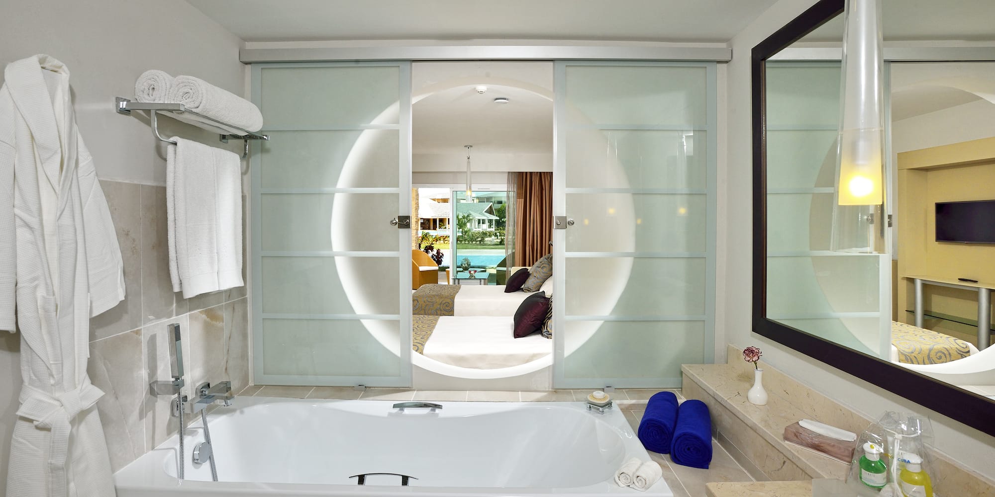 a bathroom with a tub and a mirror