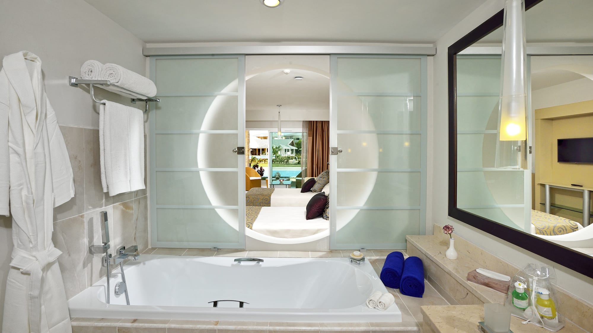 a bathroom with a tub and a mirror