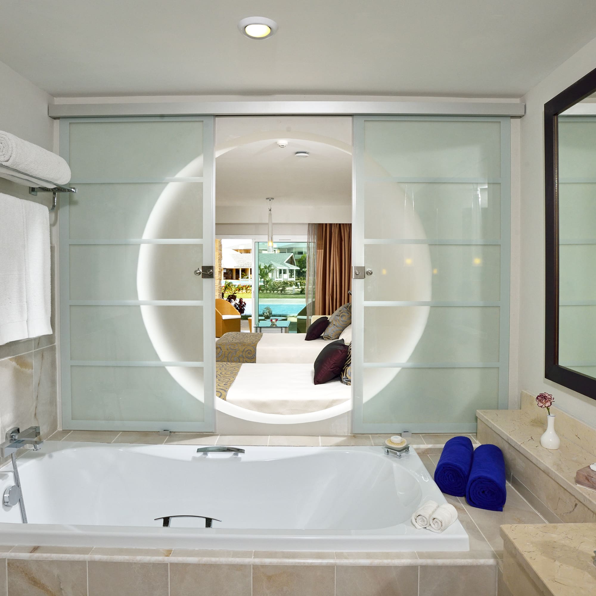 a bathroom with a tub and a mirror