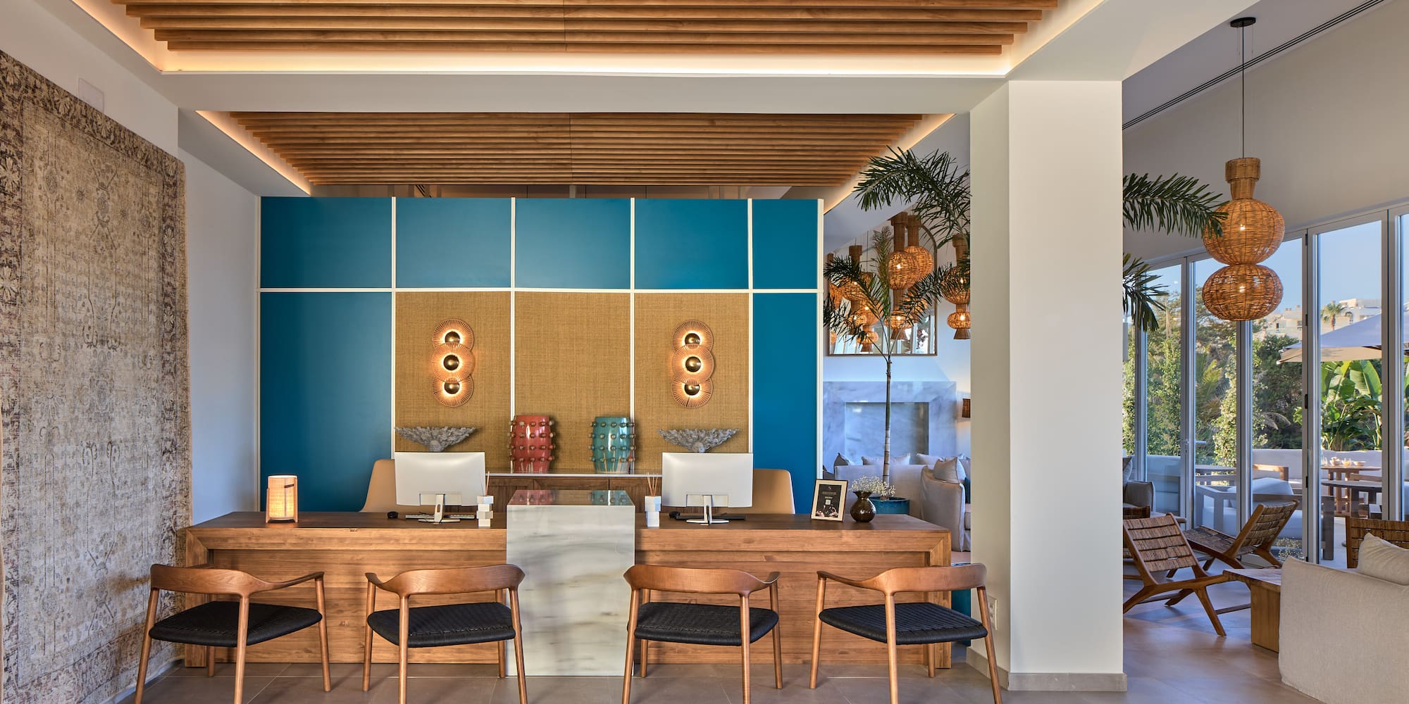 a room with a desk and chairs