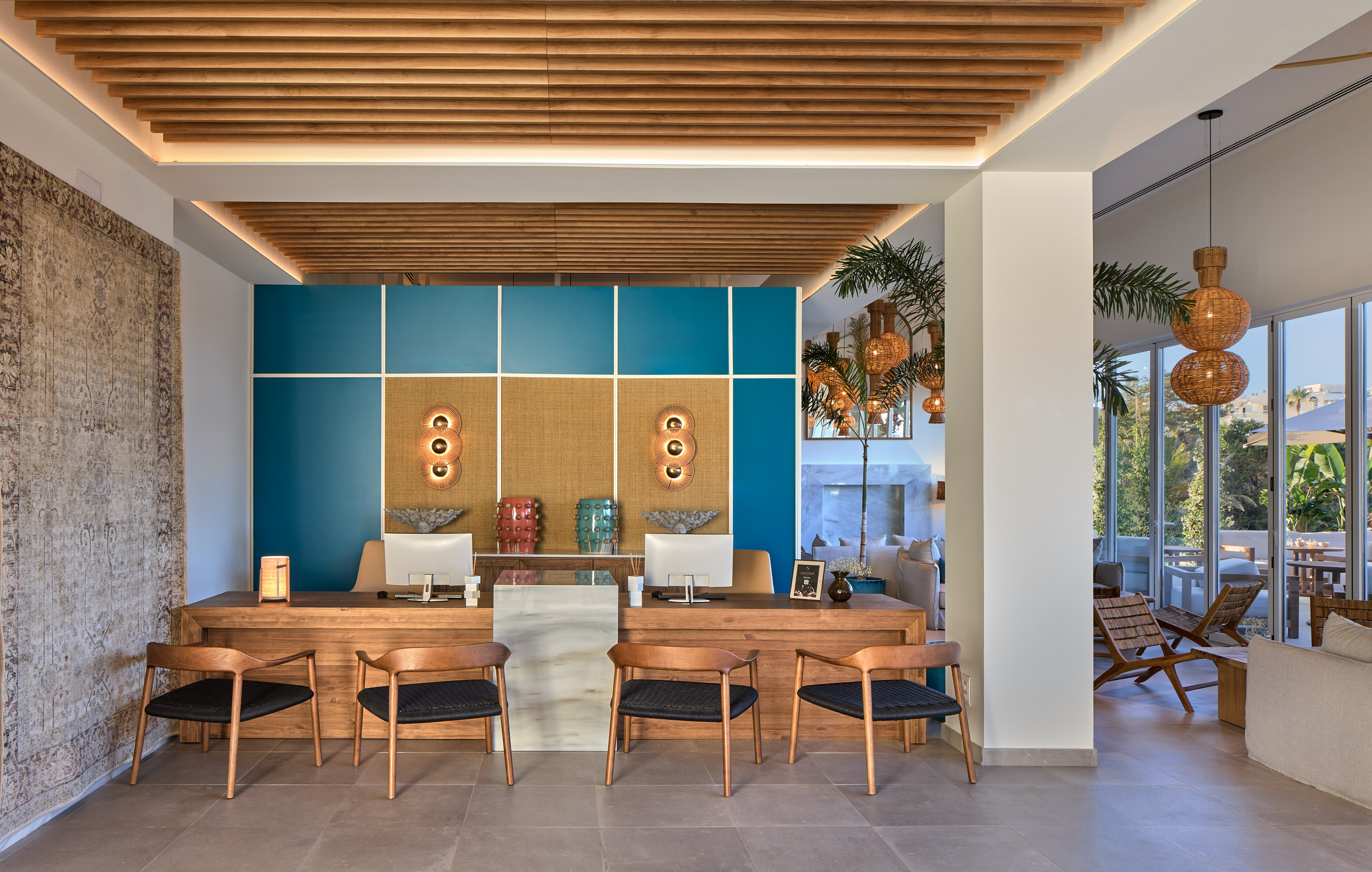 a room with a desk and chairs