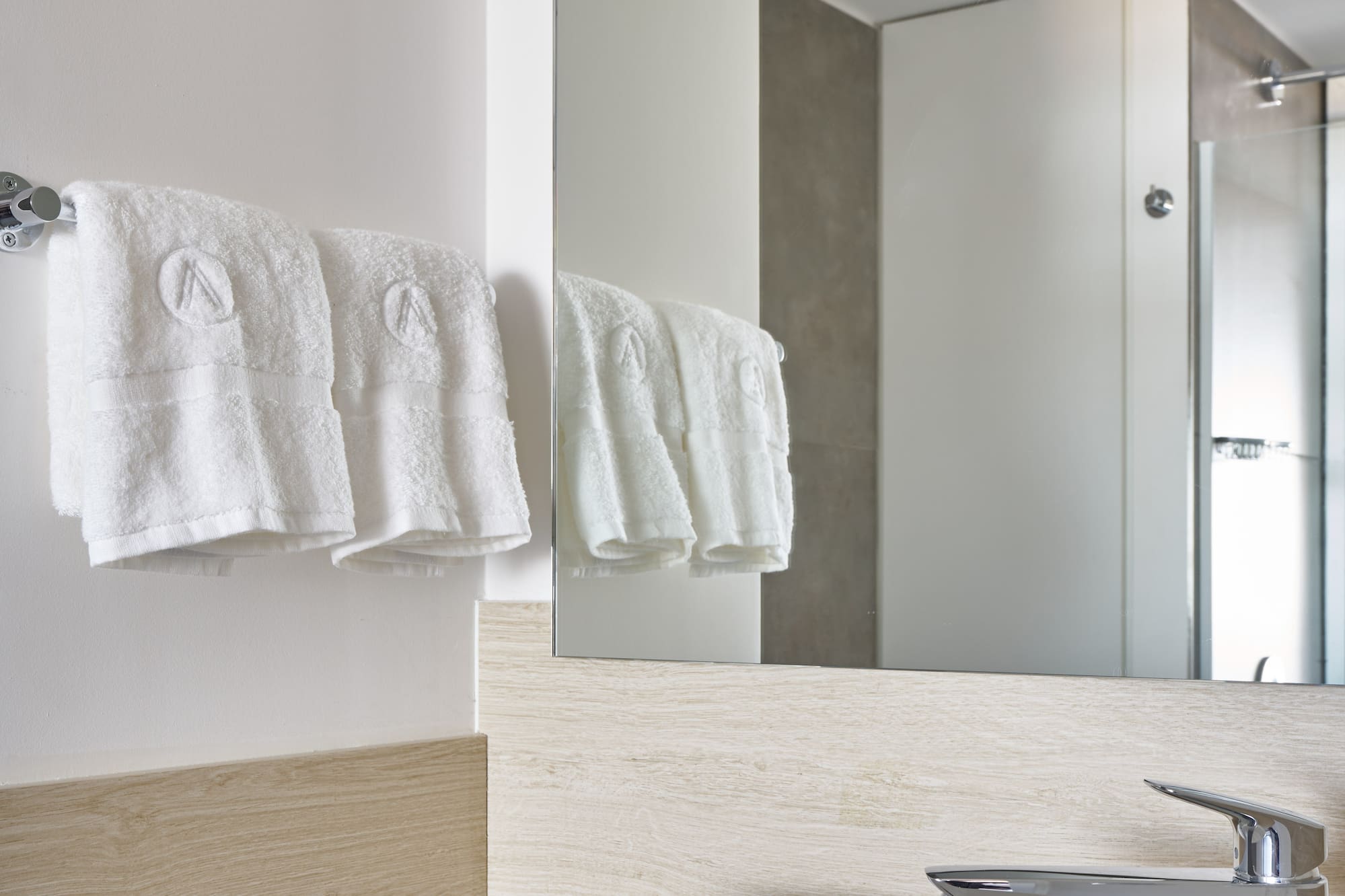 a bathroom with a sink and towels