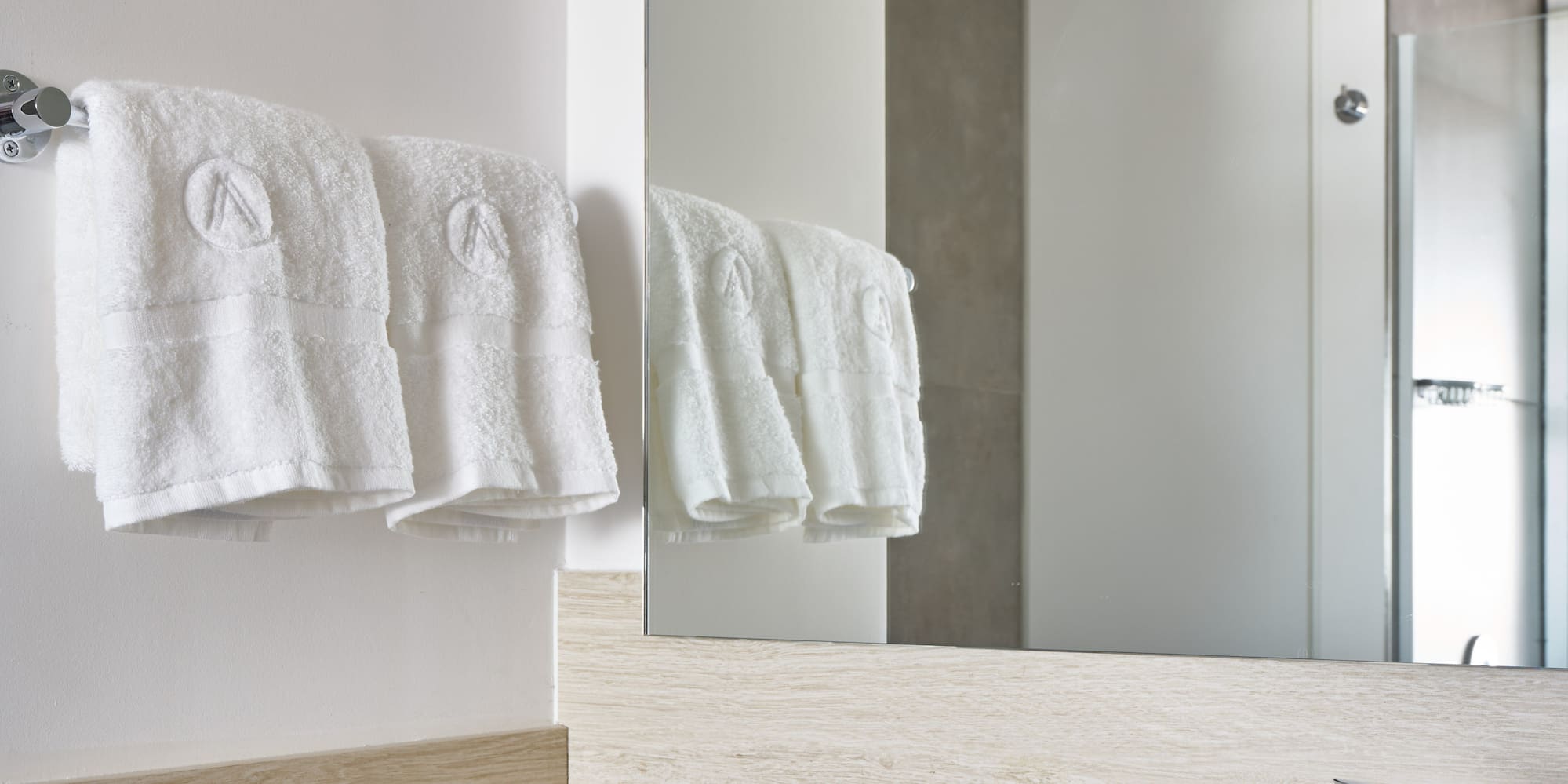 a bathroom with a sink and towels