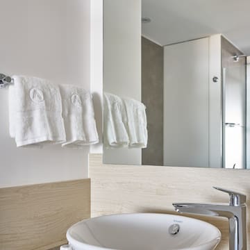 a bathroom with a sink and towels