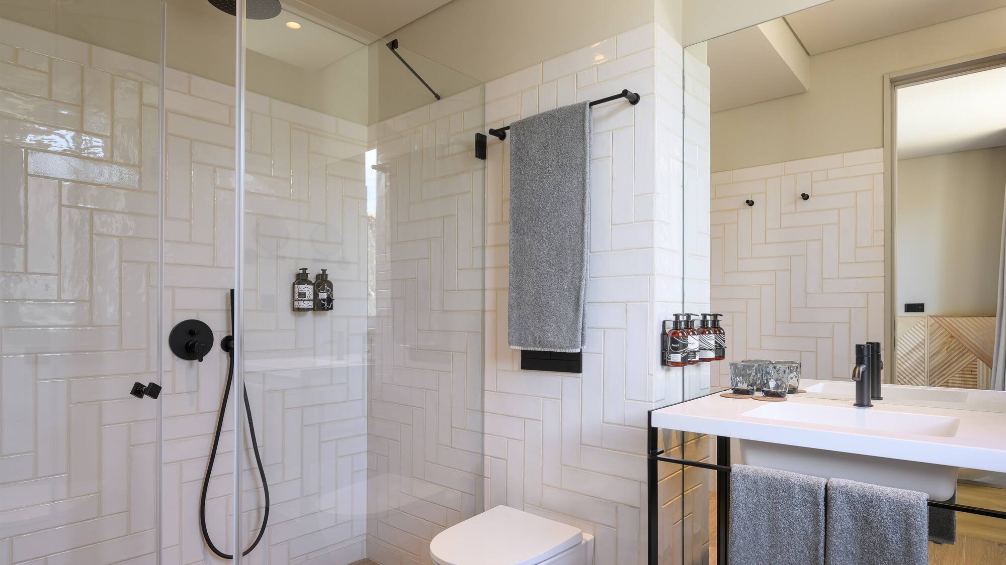 a bathroom with a shower and toilet