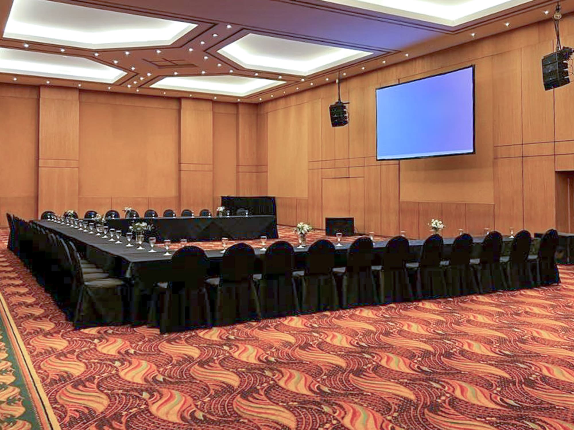 a large conference room with a large screen