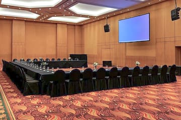 a large conference room with a large screen