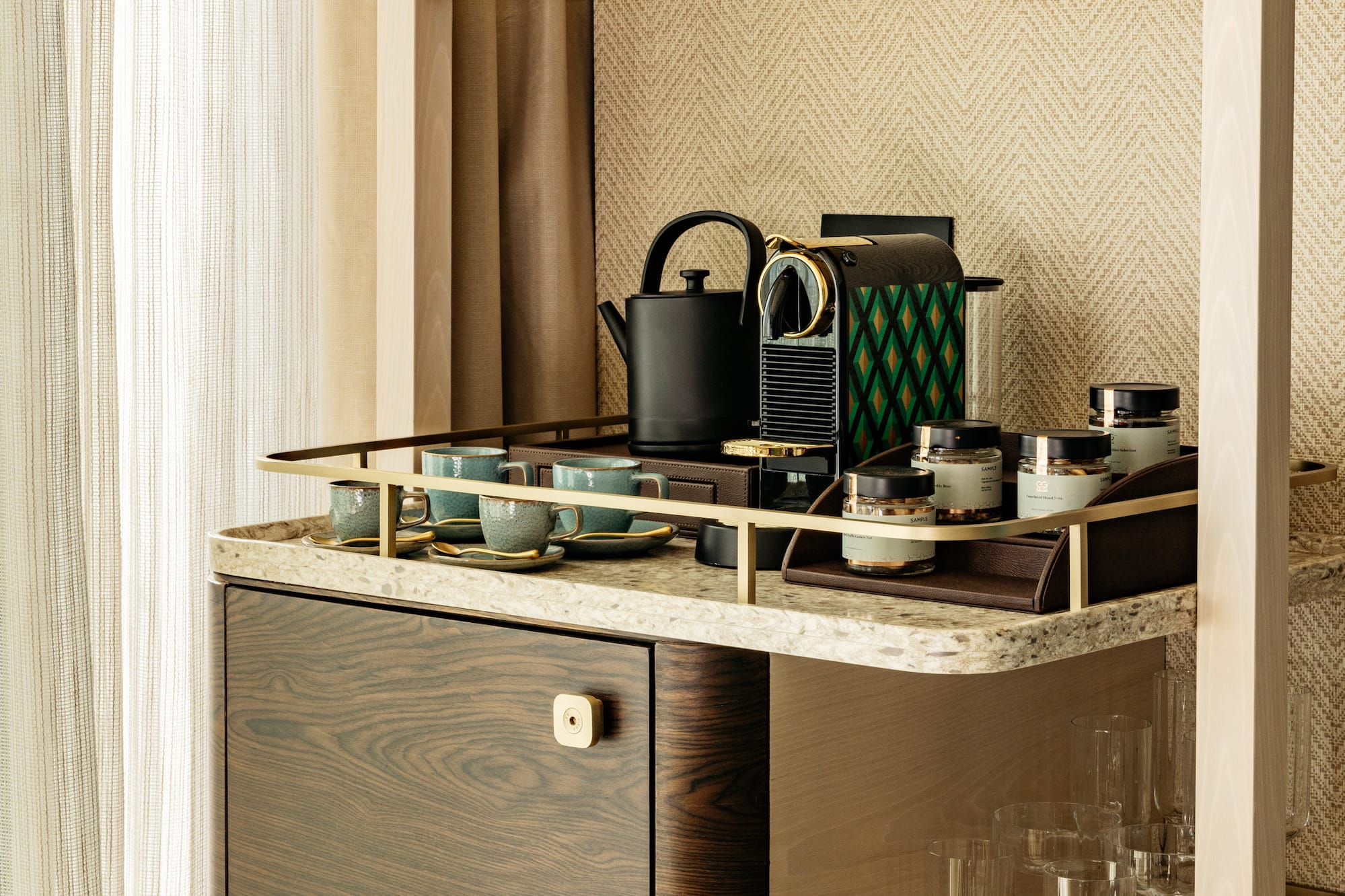 a shelf with a tea kettle and cups on it