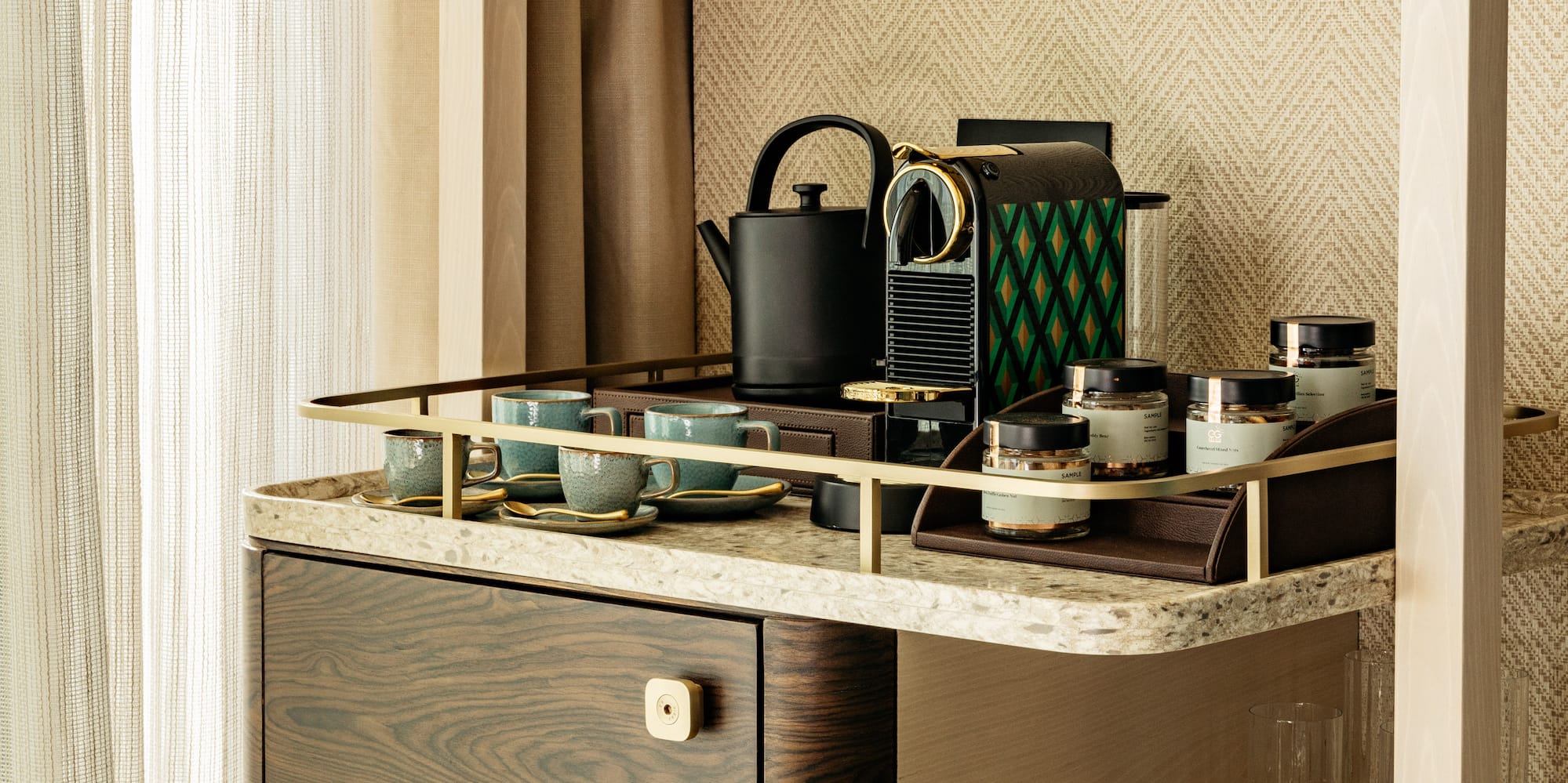 a shelf with a tea kettle and cups on it