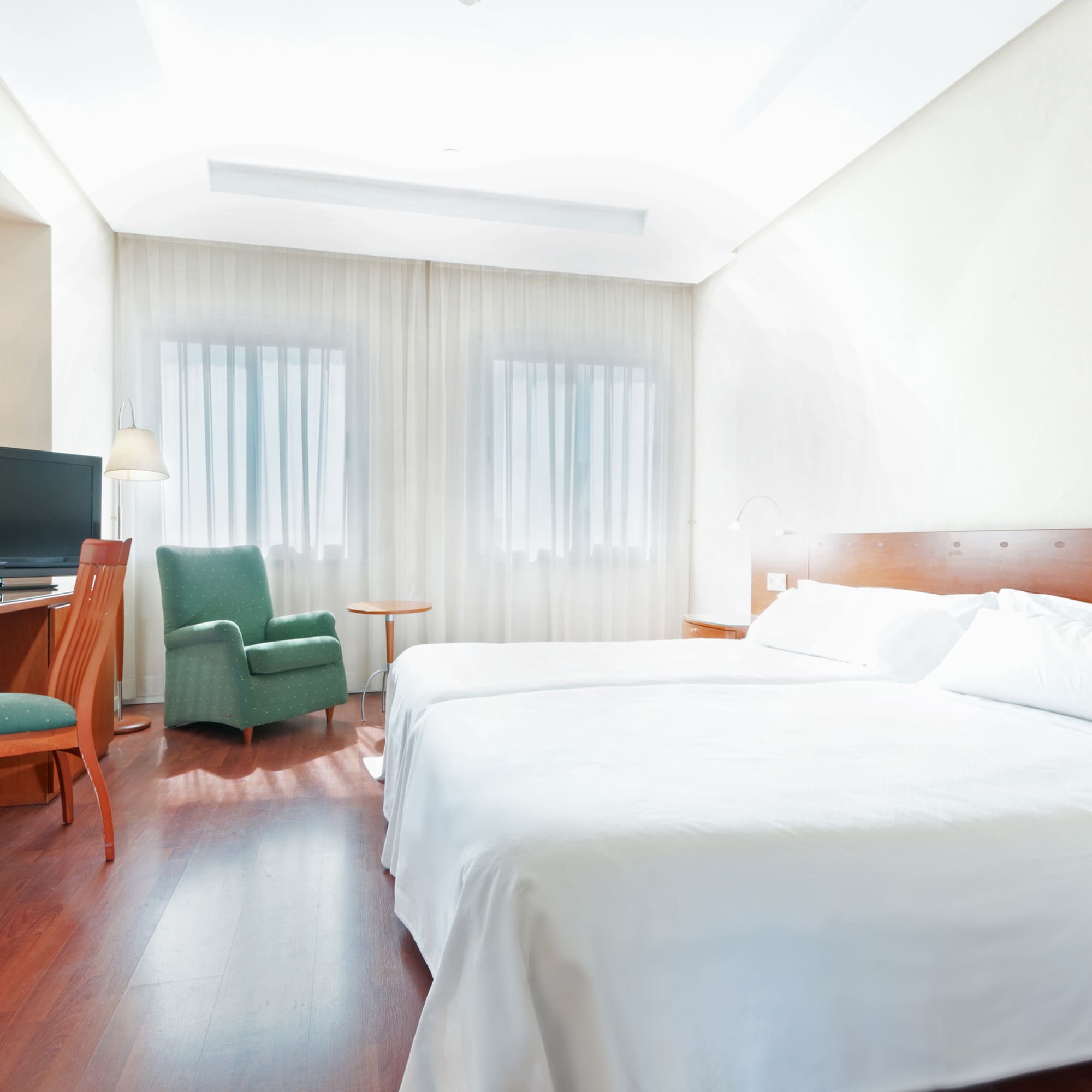 a room with a bed and a chair