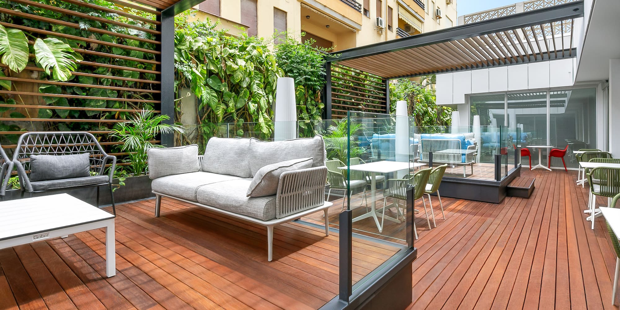a patio with a couch and chairs