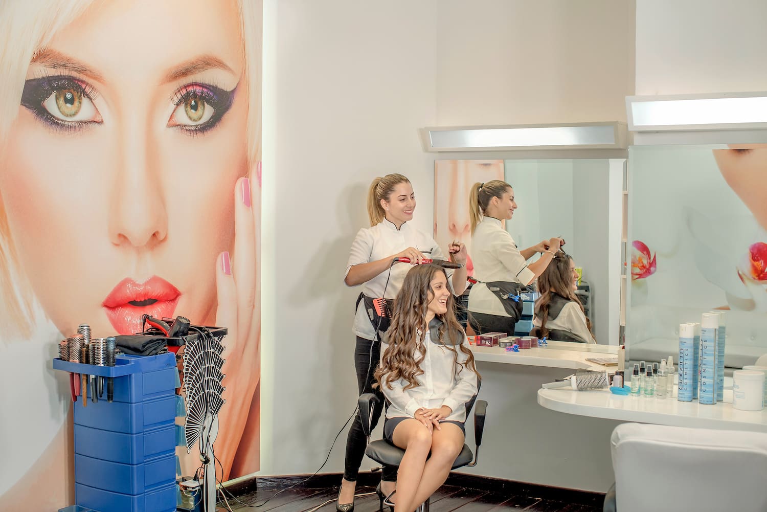 a woman getting her hair done
