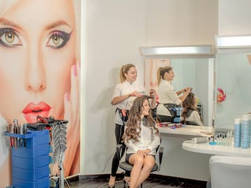 a woman getting her hair done