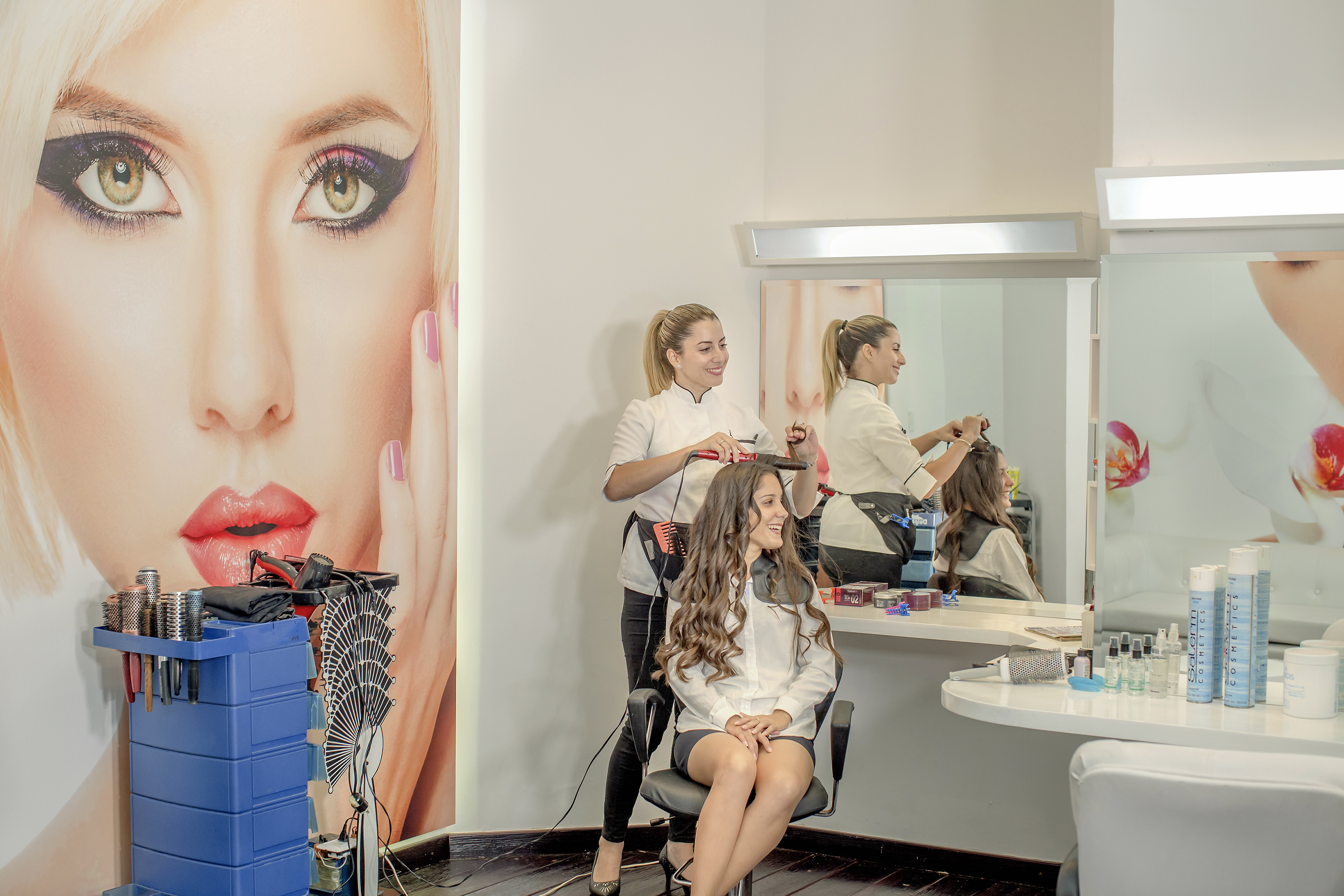 a woman getting her hair done