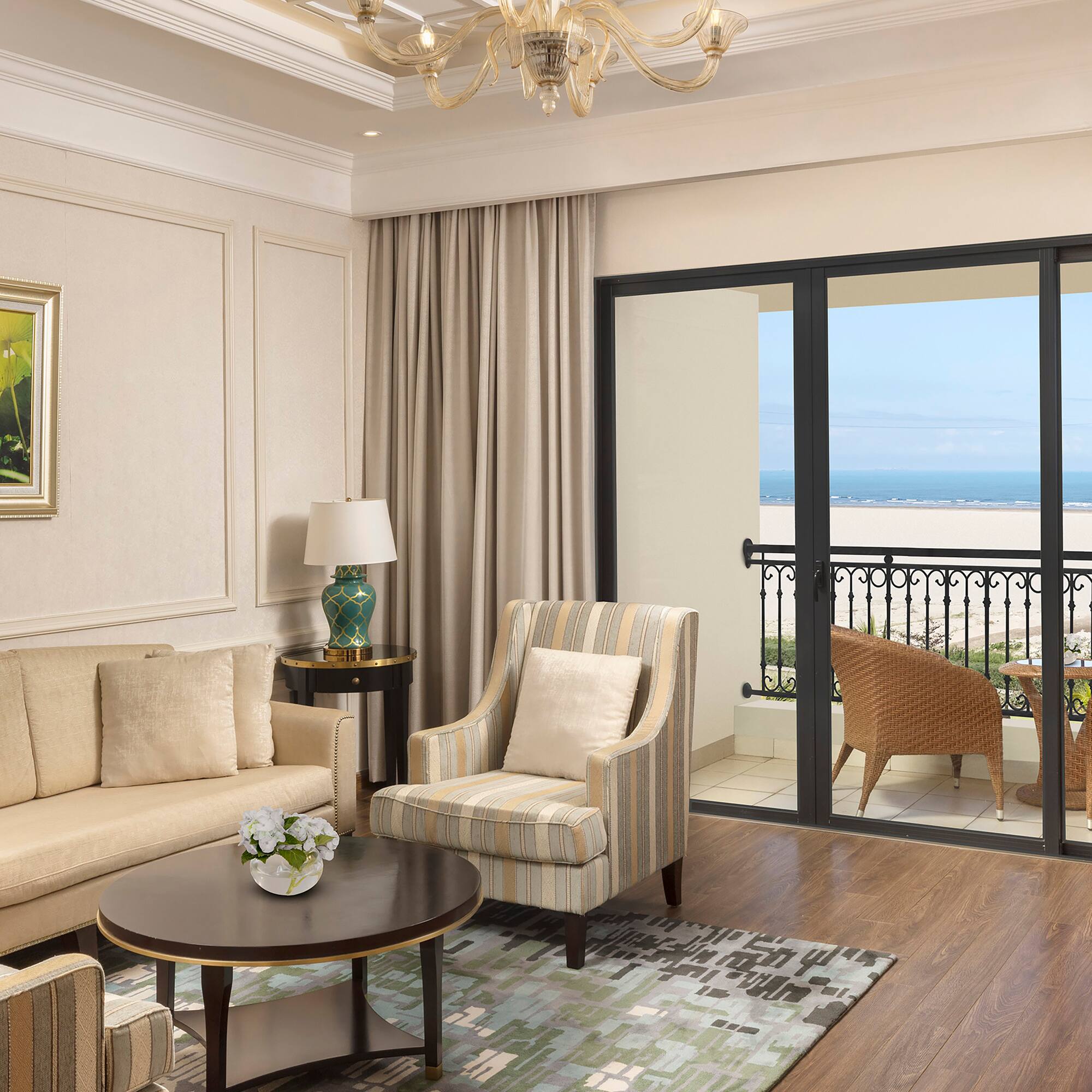 a living room with a glass door and a balcony