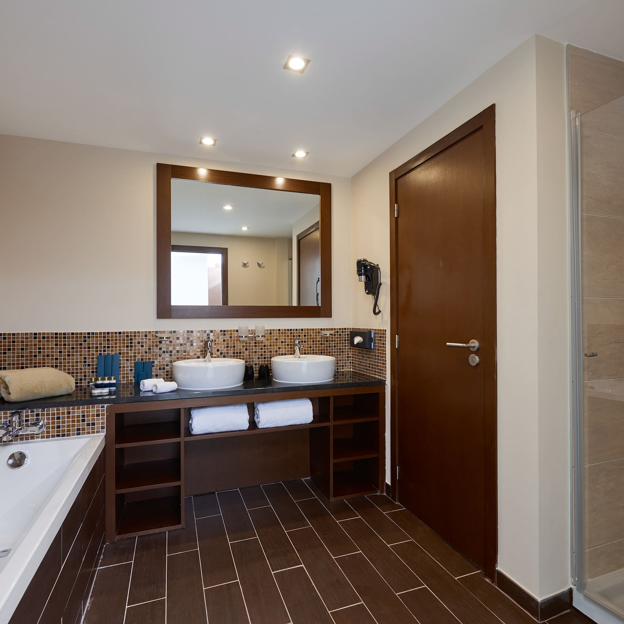 a bathroom with a bathtub and sink