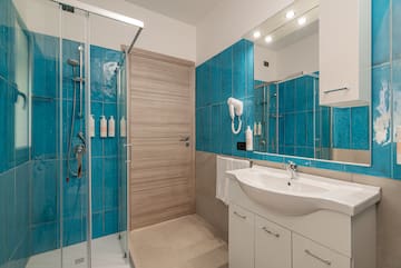 a bathroom with blue tiles