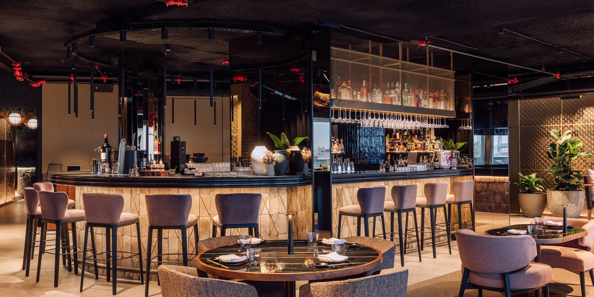 a restaurant with a bar and chairs