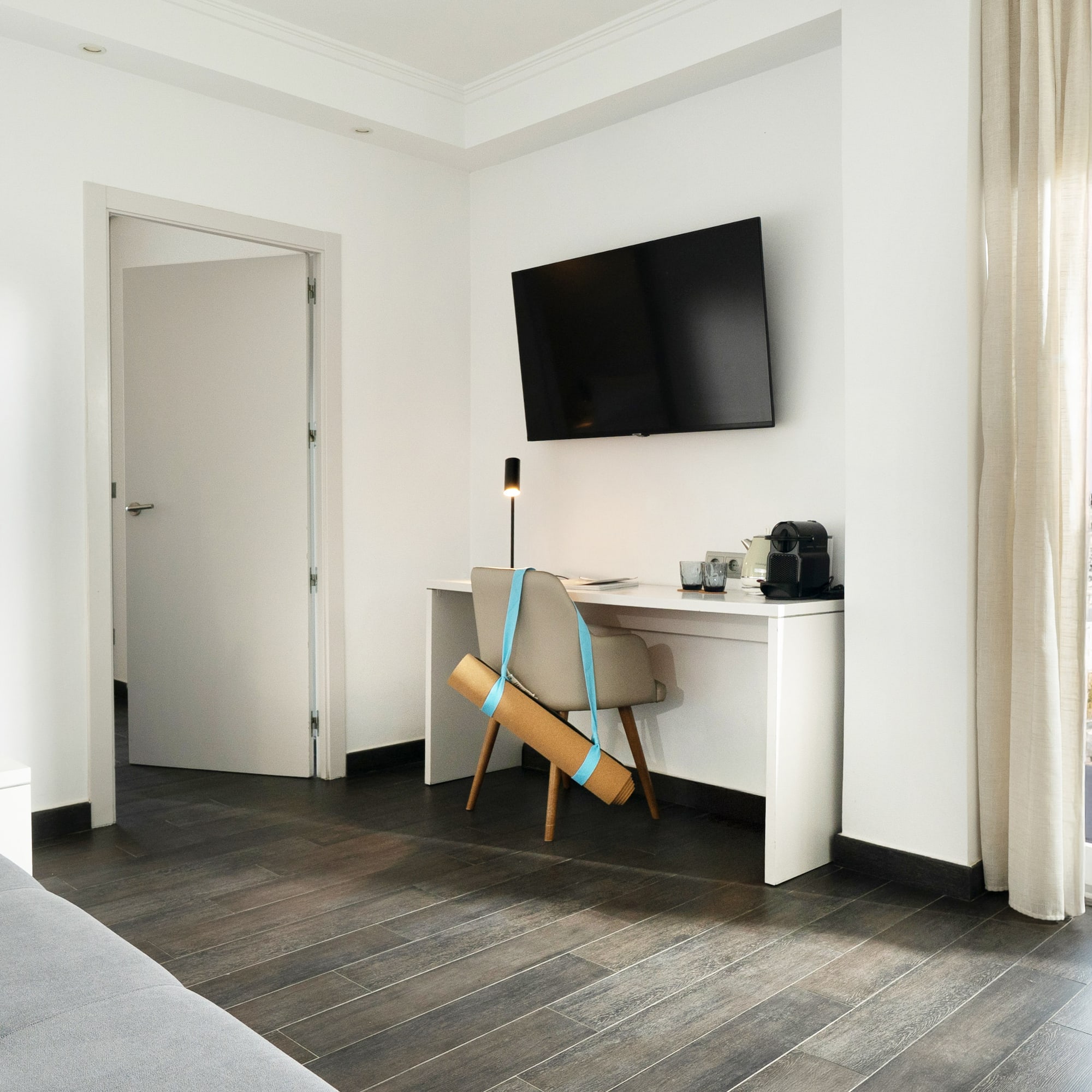 a room with a tv and a chair