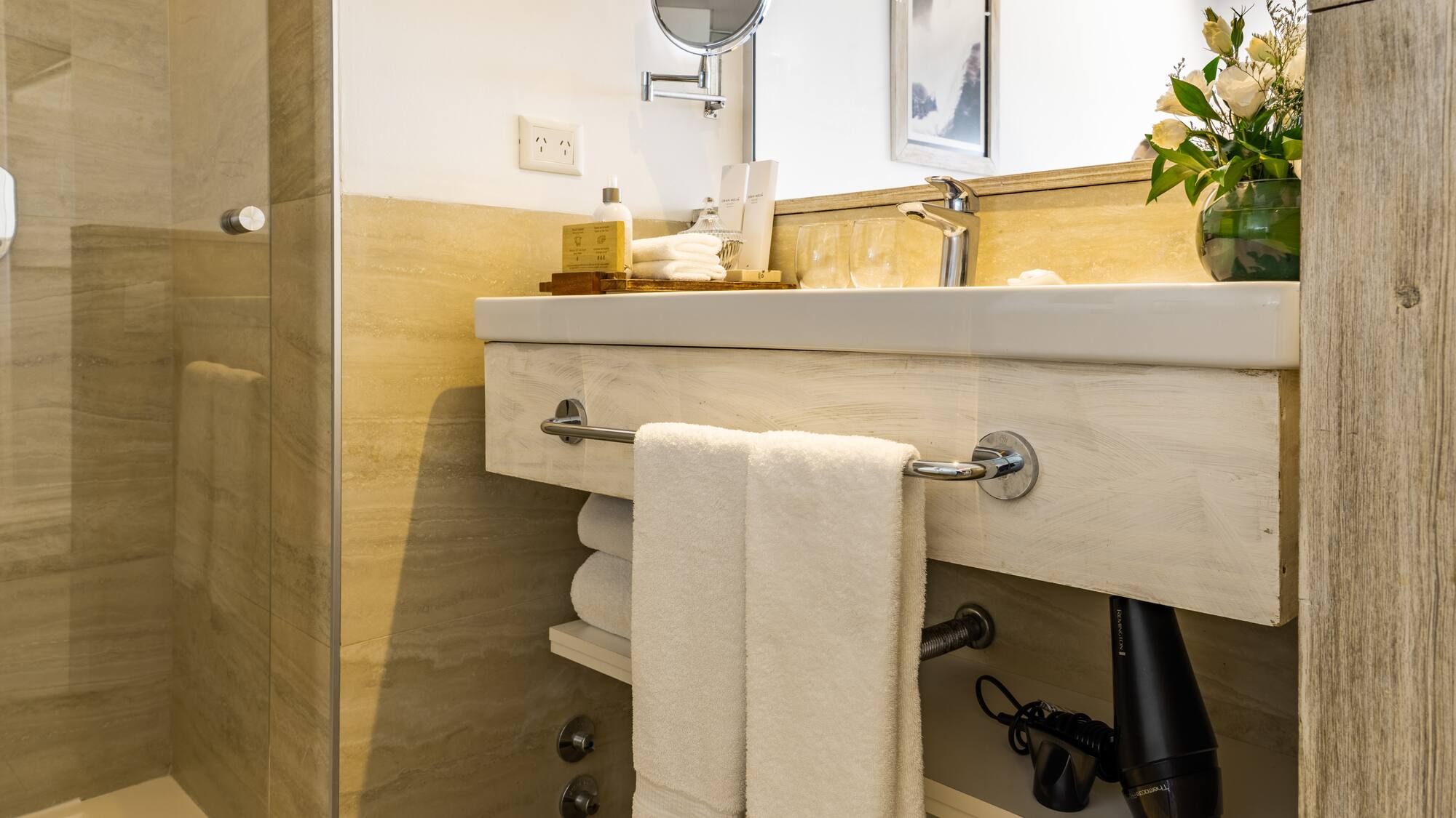 a bathroom with a mirror and towels